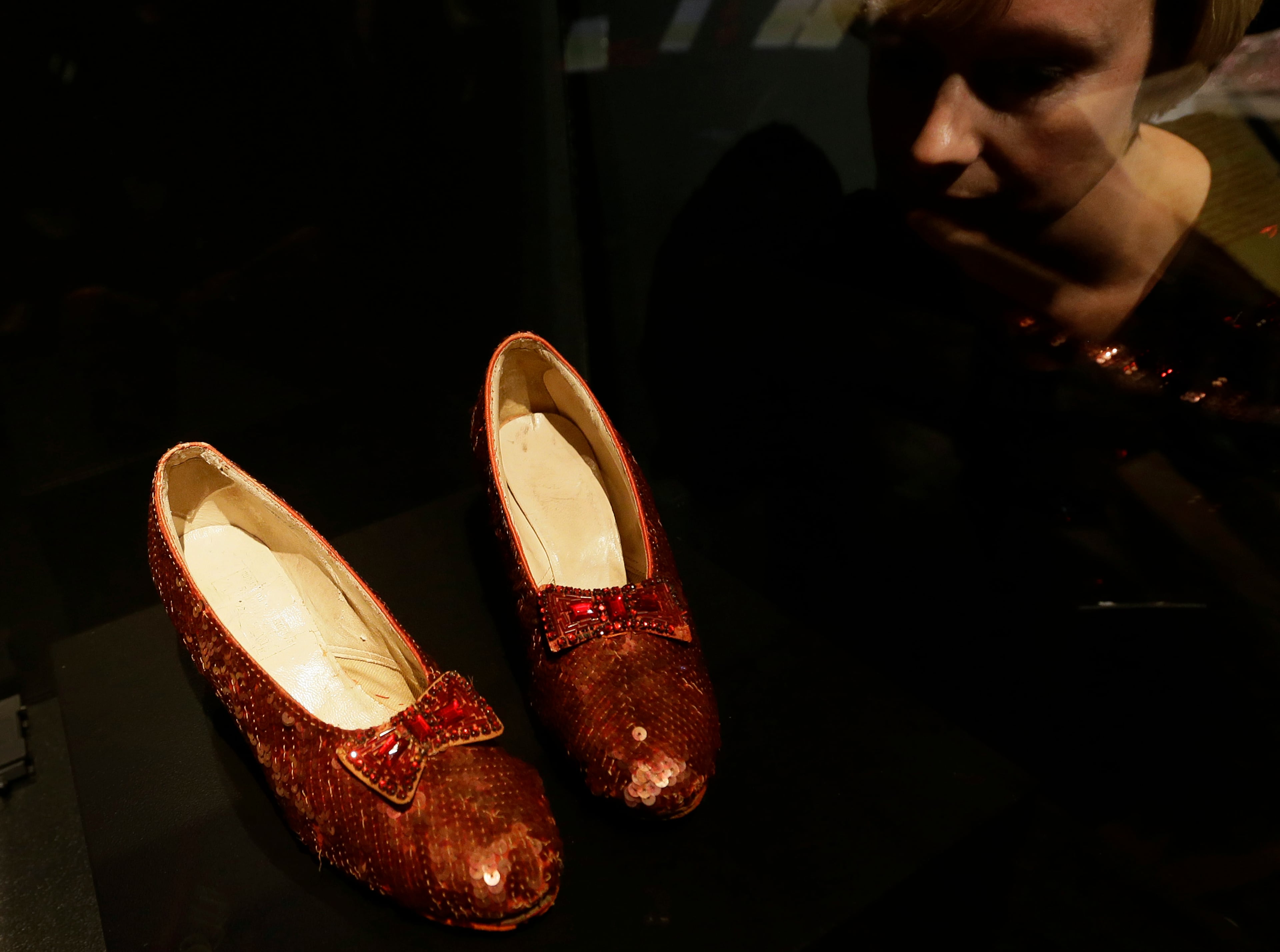 One of the four original pairs of 'Ruby Slippers' worn by Judy Garland playing Dorothy from the iconic 1939 Wizard of Oz film. The slippers were designed by MGM studios chief costume designer Adrian, who designed most of the costumes for the Wizard of Oz film.