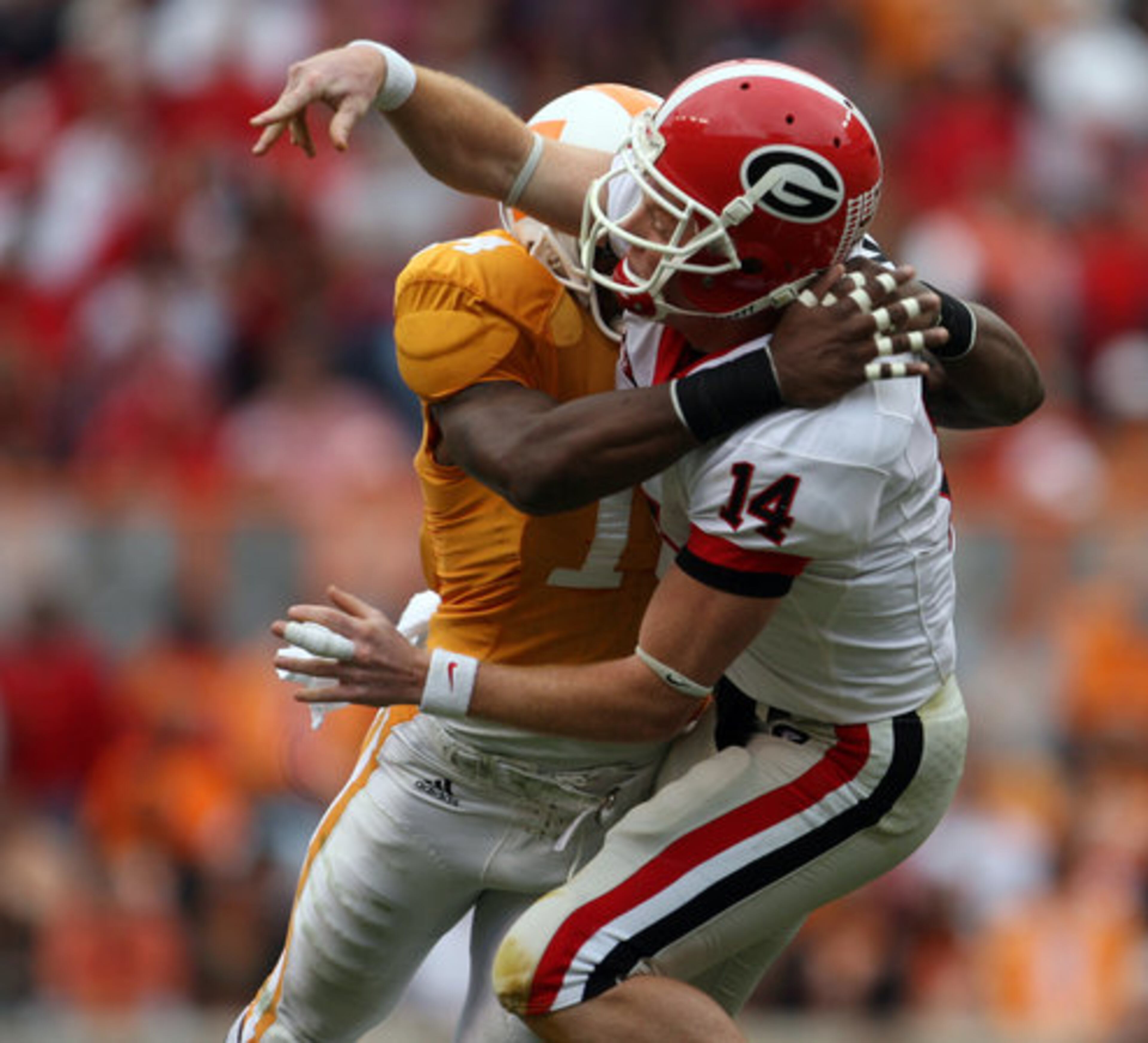 Cox receives a hard hit from Tennessee safety Eric Berry, the metro Atlanta native who had a solid game against the Dogs.