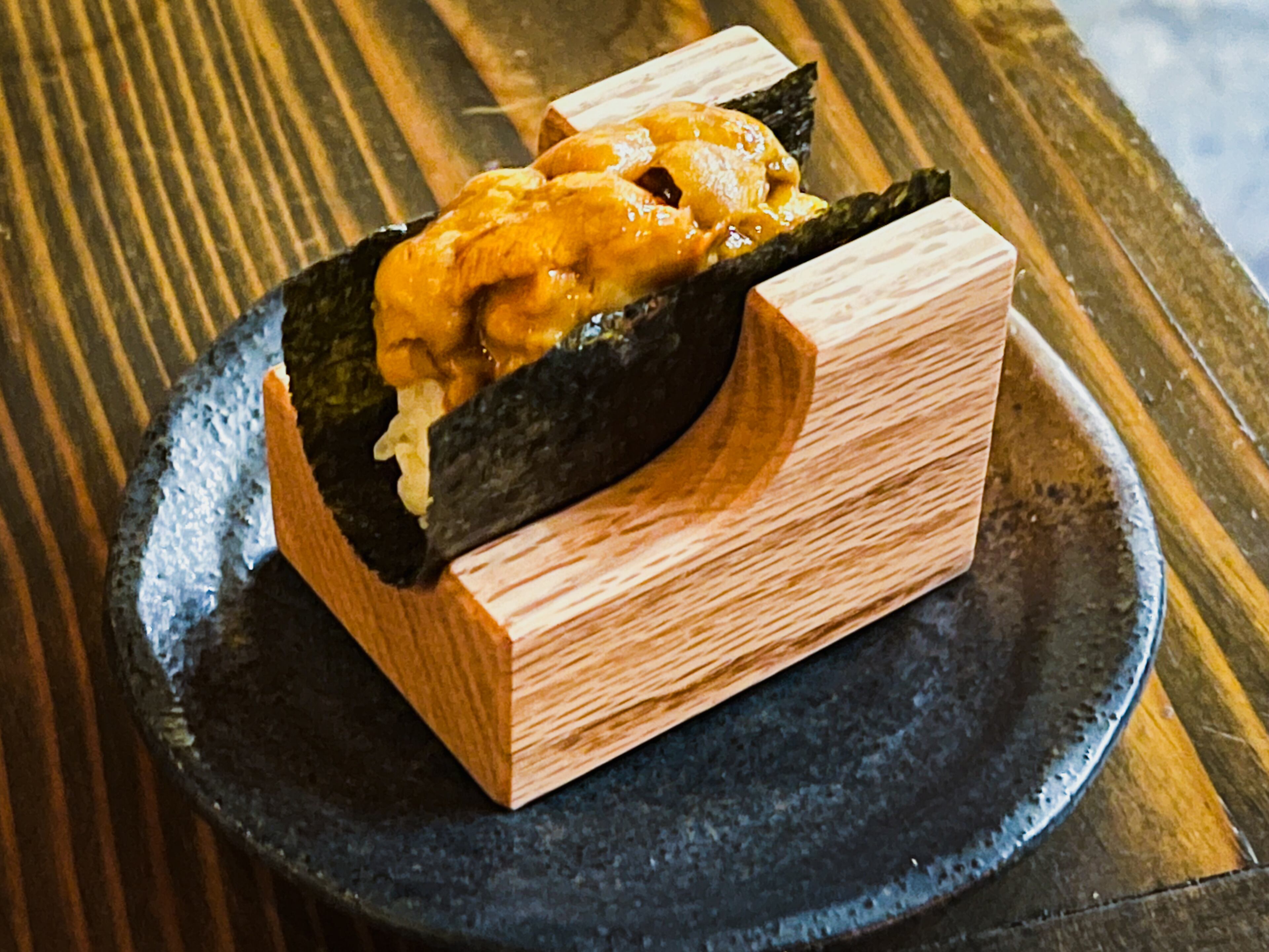The Hokkaido uni hand roll at Cuddlefish highlights the fresh sea urchin. Henri Hollis/henri.hollis@ajc.com