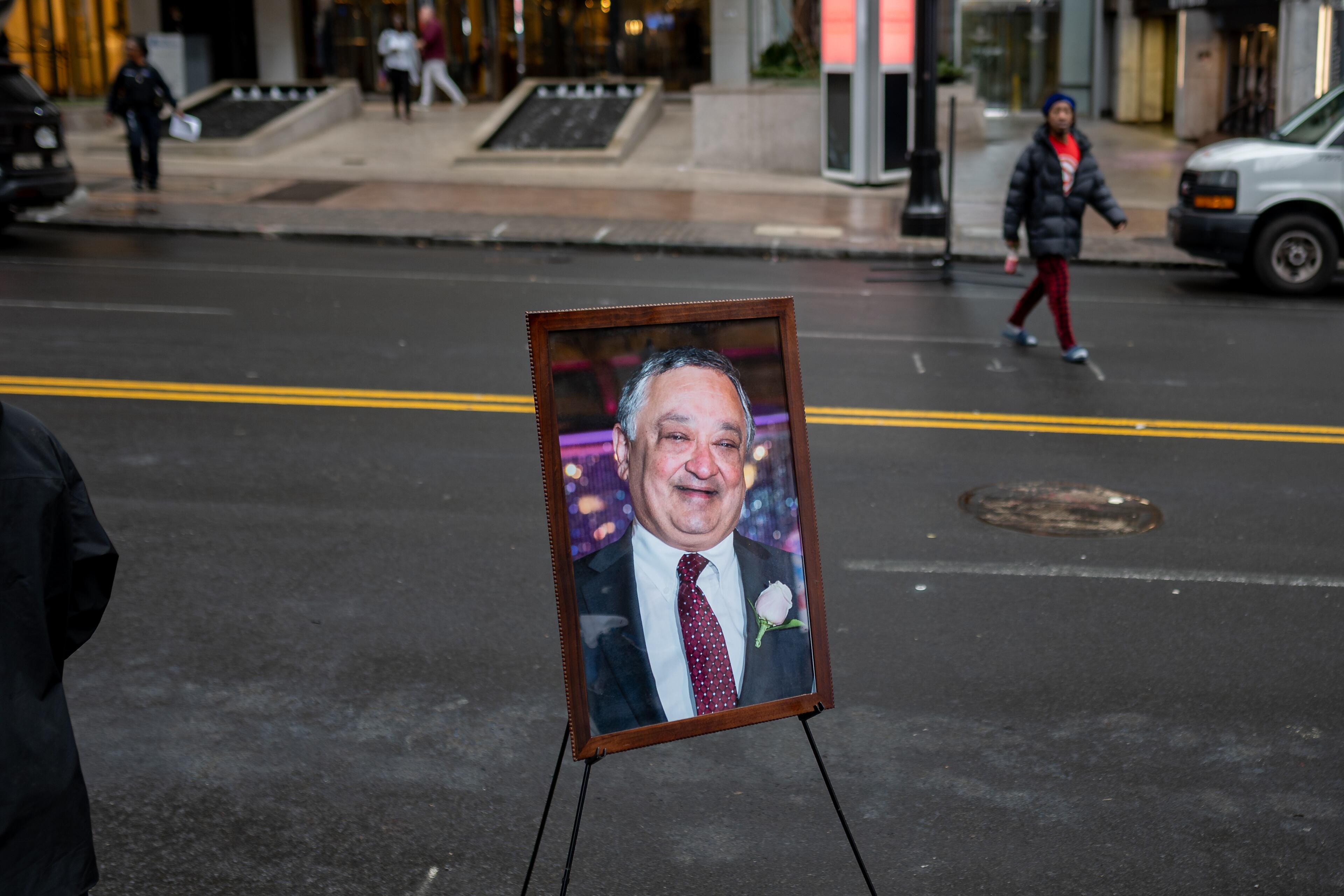 A portrait of Pradeep Sood is displayed along Peachtree Street on the first anniversary of his death in a pedestrian accident on Wednesday, Feb 11, 2026. (Ben Hendren for the AJC)