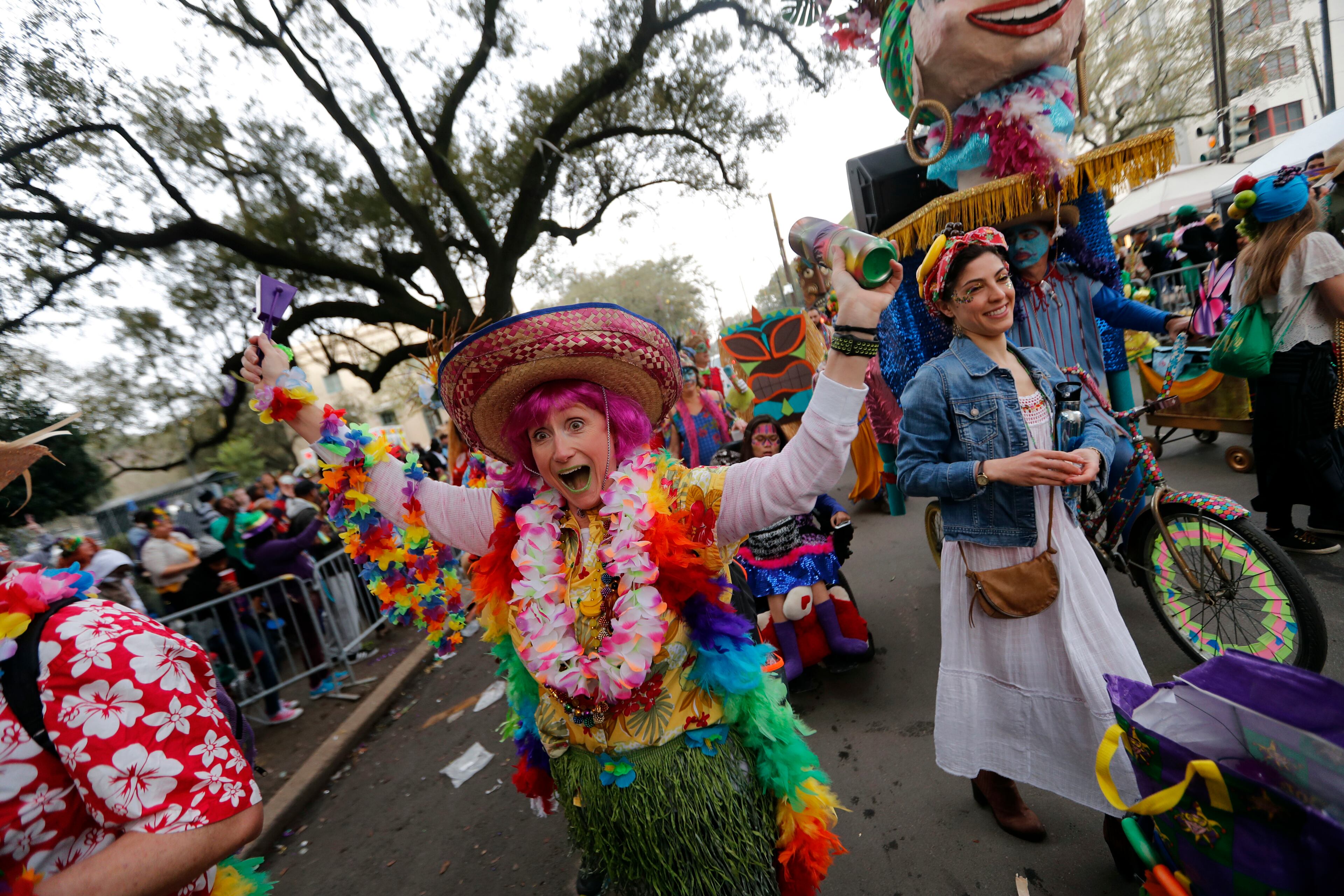 A member of the walking club Mondo Kayo revels as they march and dance down the route of the Krewe of Zulu parade on Mardi Gras day in New Orleans, Tuesday, Feb. 13, 2018. (AP Photo/Gerald Herbert)