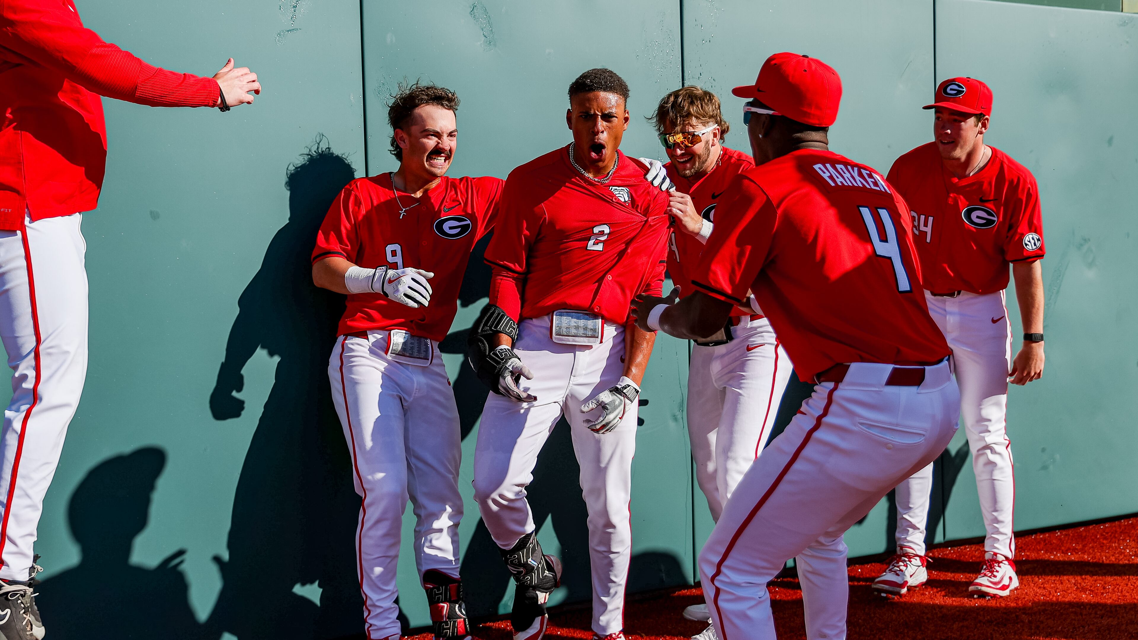 Georgia baseball infielder Ryan Black (2) celebrates with teammates in front of the center-field wall after hitting a two-run homer to walk off Florida Gulf Coast 4-3 on Sunday at Foley Field in Athens, Georgia. (Conor Dillon/UGAAA)