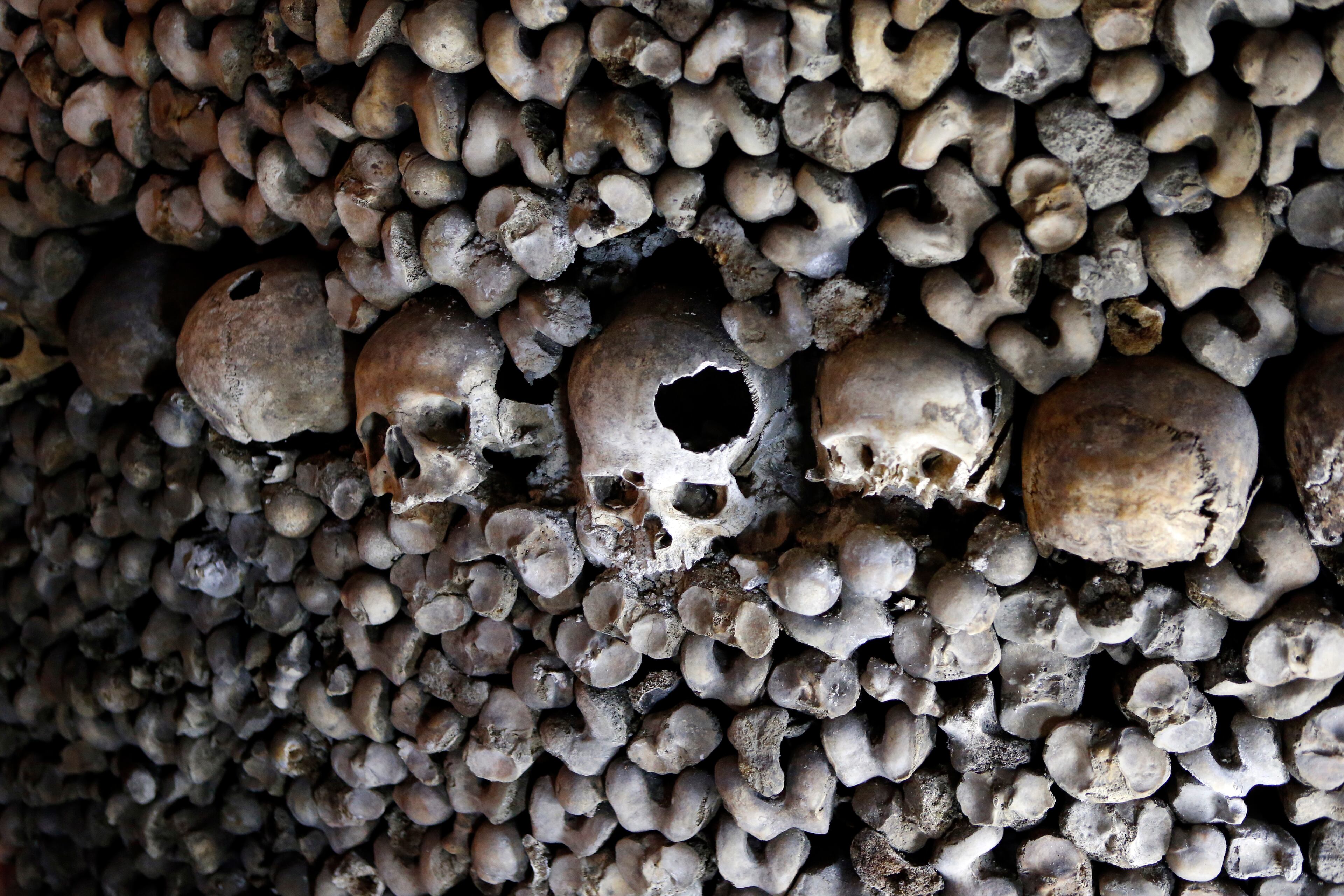 Skulls and bones are pictured in the bedroom where guests Brazilian Pedro Arruda, 27 and his mother Monica, will spend the Halloween night in Paris' creepy Catacombs, in Paris, France, Saturday, Oct, 31, 2015. House-sharing company Airbnb has struck a spooky one-off deal with Paris' City Hall to sublet the subterranean ossuaries, the final resting place of 6 million bodies, on Nov. 31 to the winner of a worldwide competition. (AP Photo/Francois Mori)