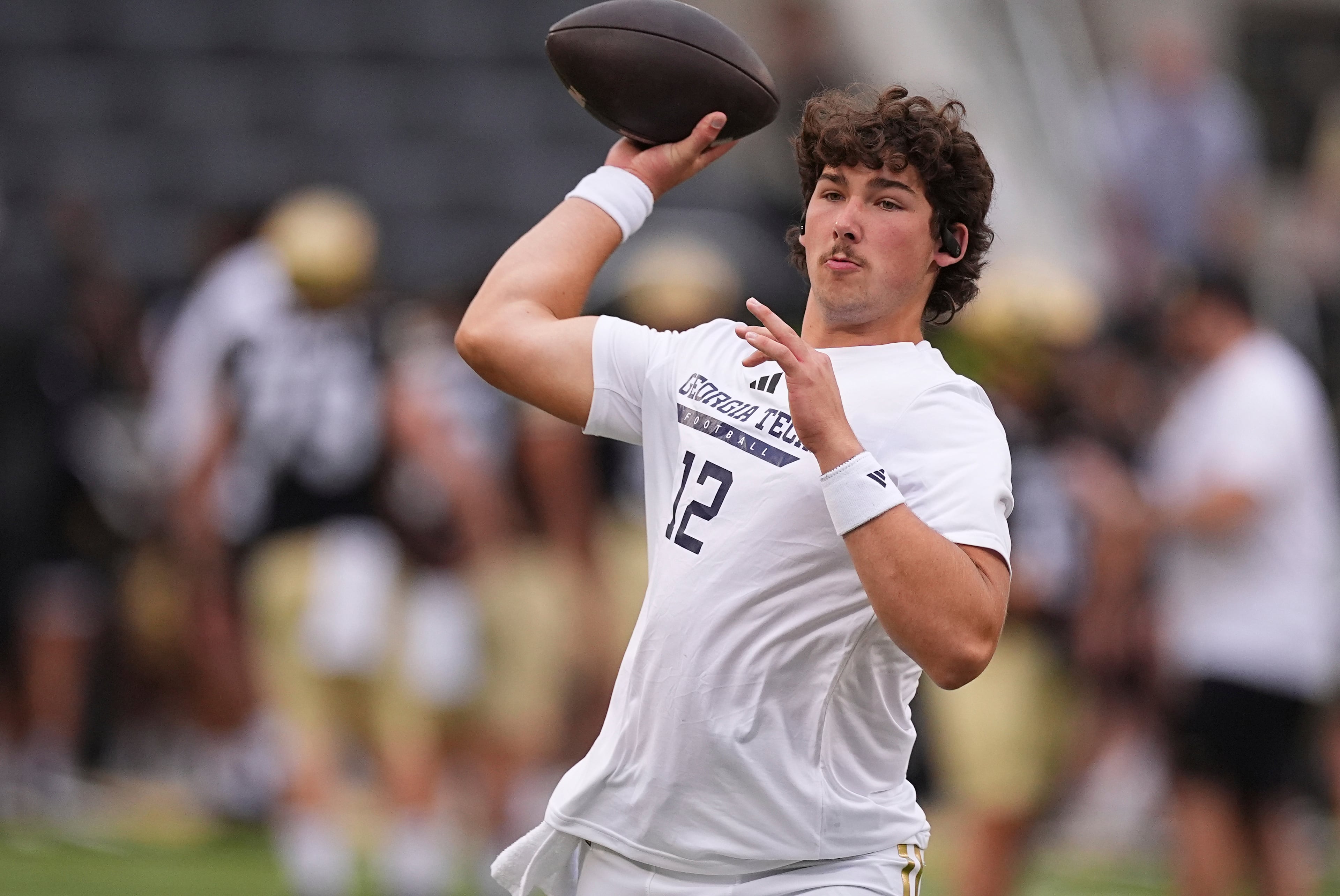 Georgia Tech quarterback Aaron Philo warms up before a game against Colorado on Friday, Aug. 29, 2025, in Boulder, Colo. (David Zalubowski/AP)