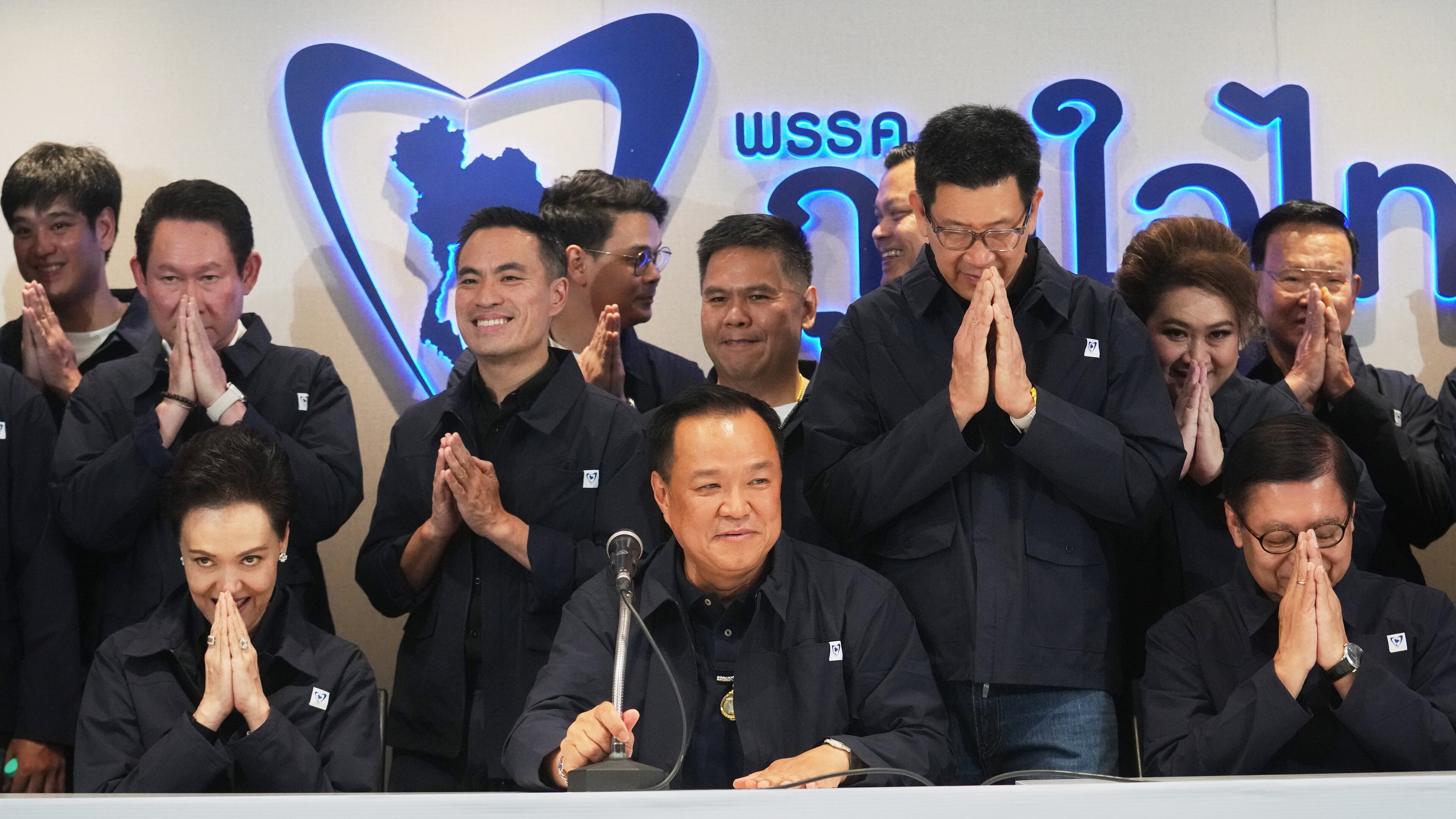 Thailand's Prime Minister and leader of Bhumjaithai Party Anutin Charnvirakul, center, speaks during a press conference at the party headquarters following the general election in Bangkok, Sunday, Feb. 8, 2026. (AP Photo/Sakchai Lalit)