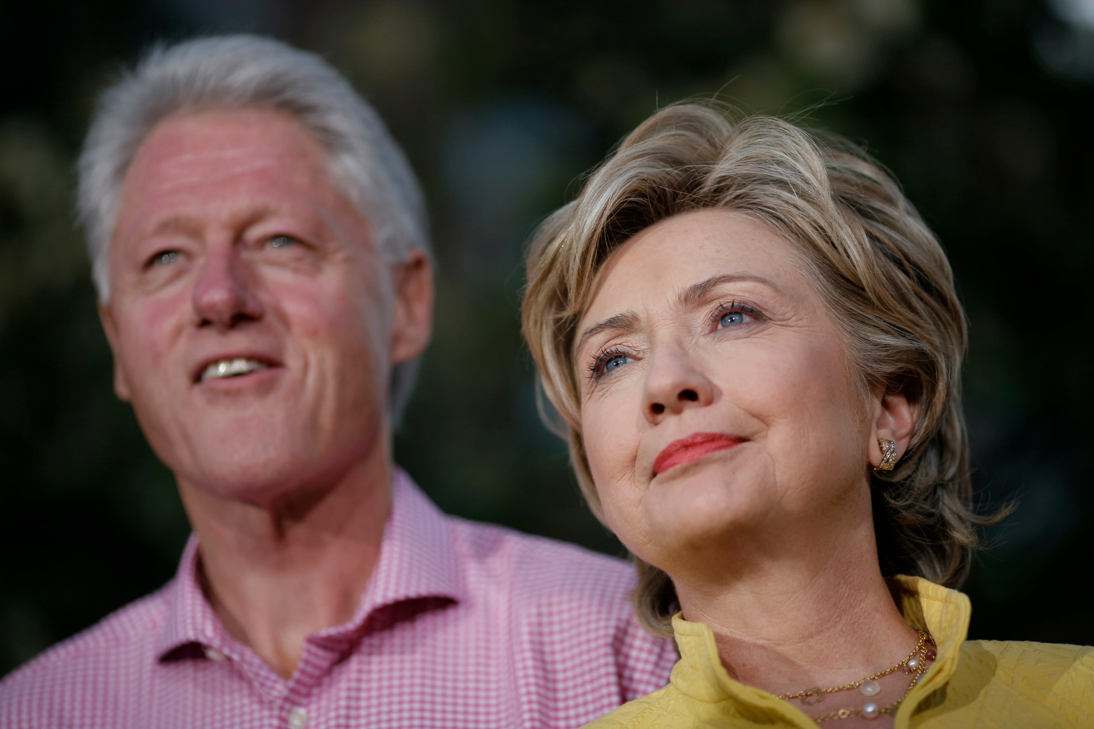 PORTSMOUTH, NH - SEPTEMBER 02: Democratic presidential hopeful Sen. Hillary Rodham Clinton (D-NY) speaks while former US President Bill Clinton listens at a fall kick-off campaign rally, September 02, 2007, at Market Square in Portsmouth, New Hampshire. The Clintons are making a Labor Day holiday weekend campaign trip through New Hampshire and Iowa. (Photo by Charles Ommanney/Getty Images)