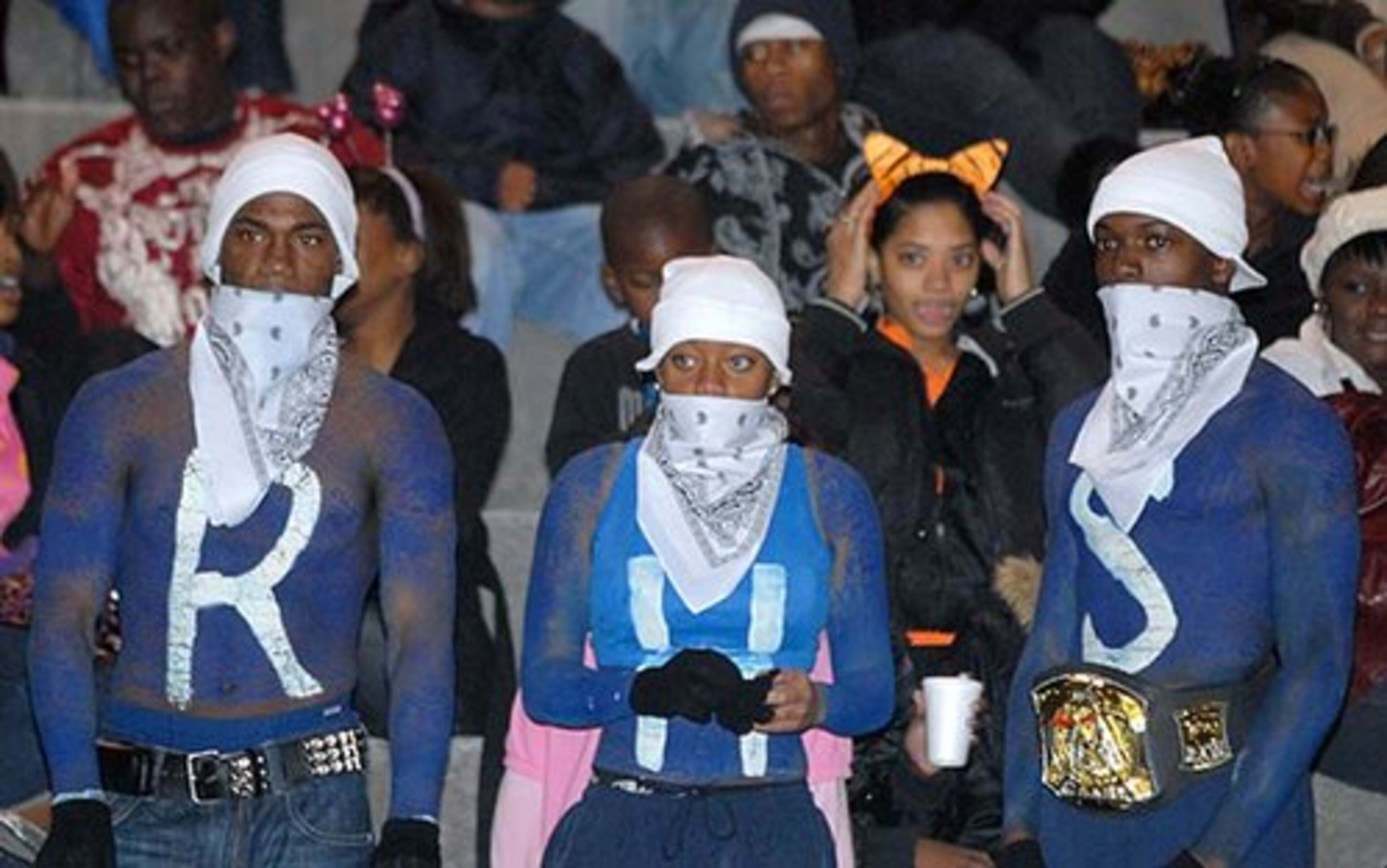Redan fans Eddie Martin, Janice Taylor, and Jeremy Dix (left to right) seem a little let down as the Raiders trail late in the first half.