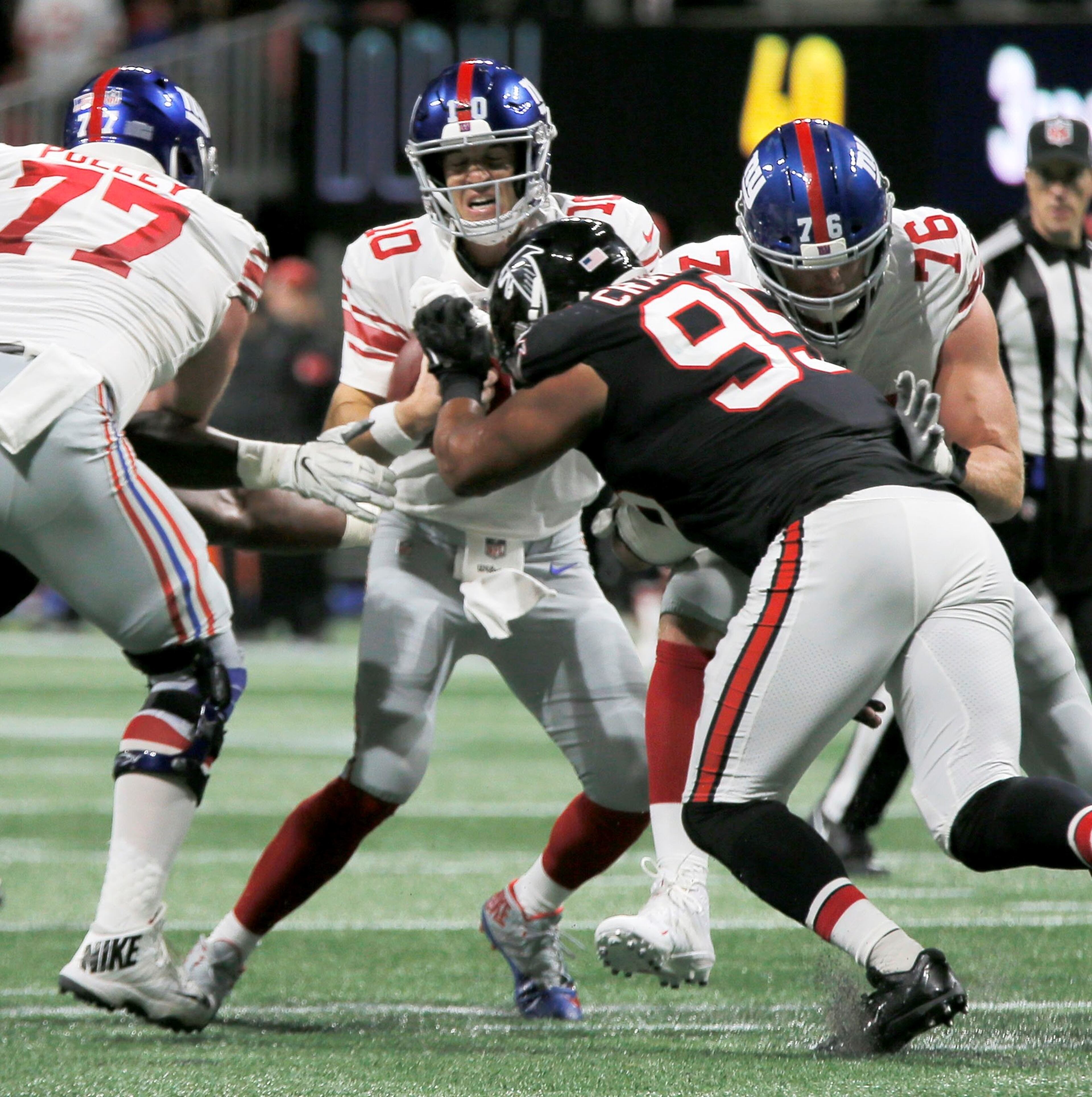 10/22/18 - Atlanta - Atlanta Falcons defensive end Jack Crawford (95) gets to New York Giants quarterback Eli Manning (10) on one of the Falcons first half sacks. The Atlanta Falcons played the New York Giants in an NFL football game Monday, October 22, 2018, at Mercedes-Benz Stadium in Atlanta, GA. BOB ANDRES / BANDRES@AJC.COM