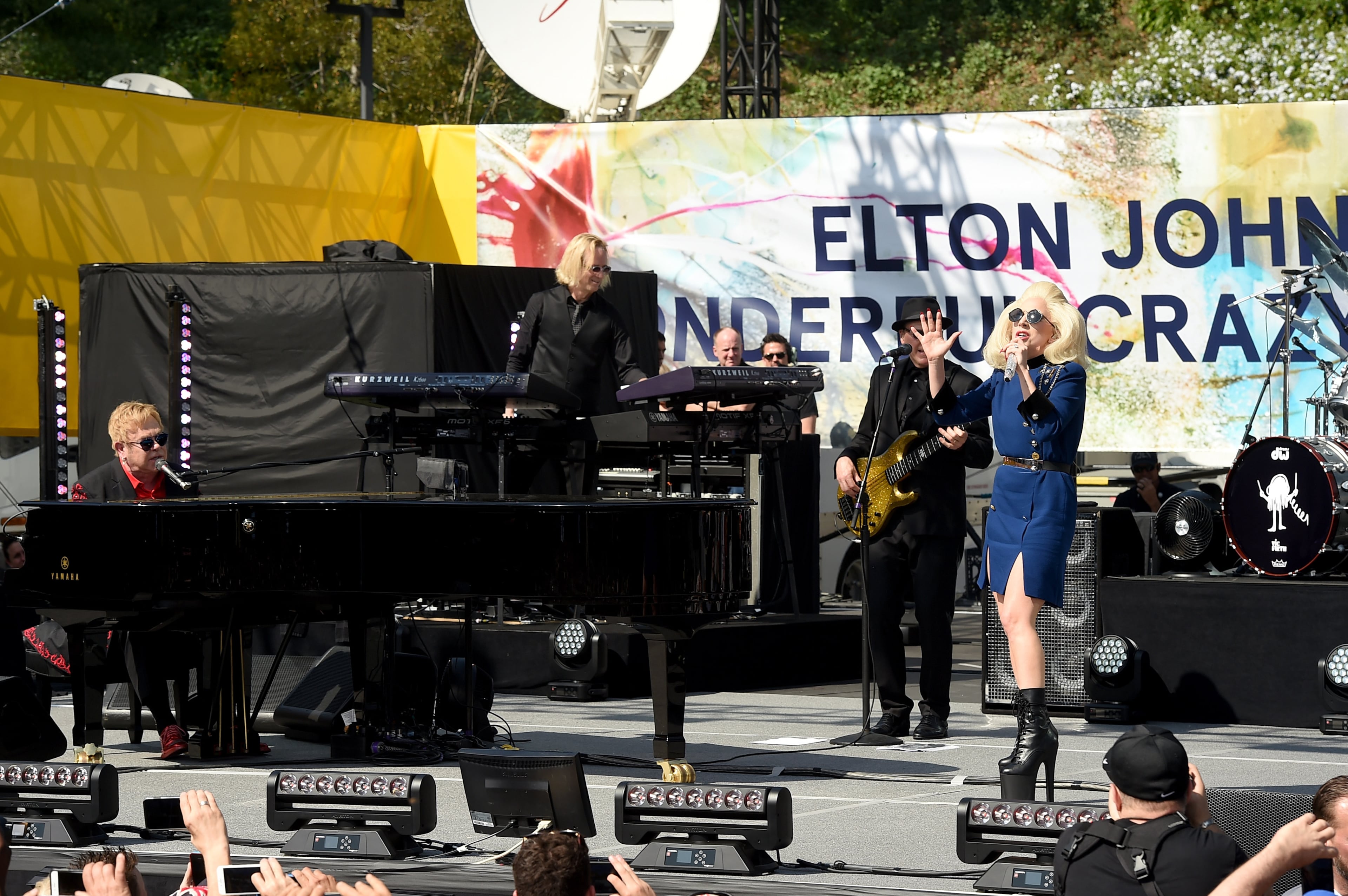 WEST HOLLYWOOD, CA - FEBRUARY 27: Elton John (L) and Lady Gaga perform live on the Sunset Strip, on February 27, 2016, as a thank you to the City of West Hollywood for their support of the Elton John AIDS Foundation. The concert was streamed live on AOL.com and co-presented by AOL and BBVA. (Photo by Kevin Winter/Getty Images for AOL)