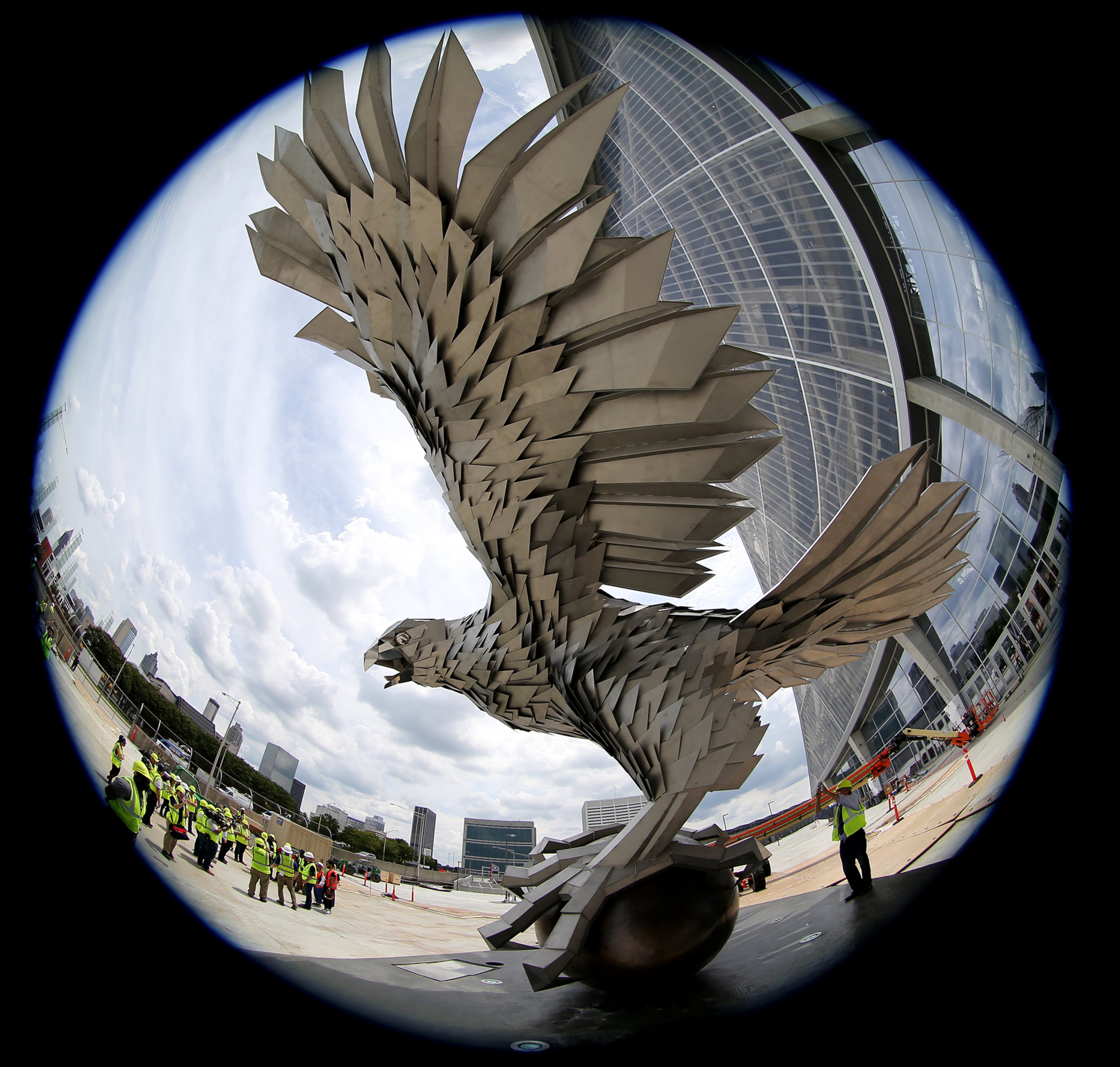 June 1, 2017, Atlanta: Visitors take in the giant falcon sculpture in the Fan Plaza during a tour of Mercedes-Benz Stadium on Thursday, June 1, 2017, in Atlanta. Curtis Compton/ccompton@ajc.com