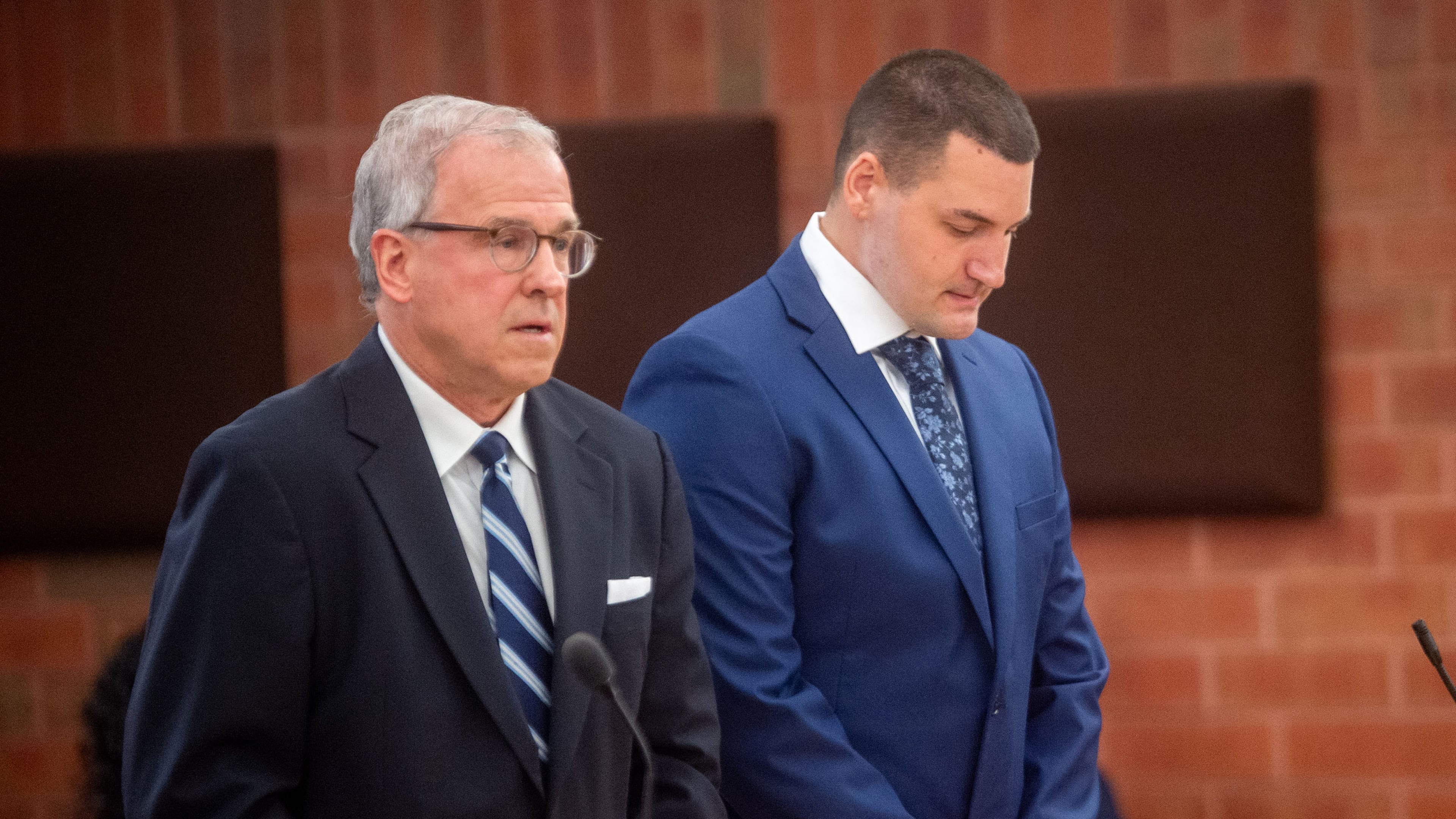 Former Hartford police officer Joseph Magnanom, right, stands with his attorney, Patrick Tomasiewicz, during his arraignment at Hartford Superior Court in Hartford, Conn., on Friday, June 5, 2026. (Aaron Flaum/Hartford Courant via AP, Pool)