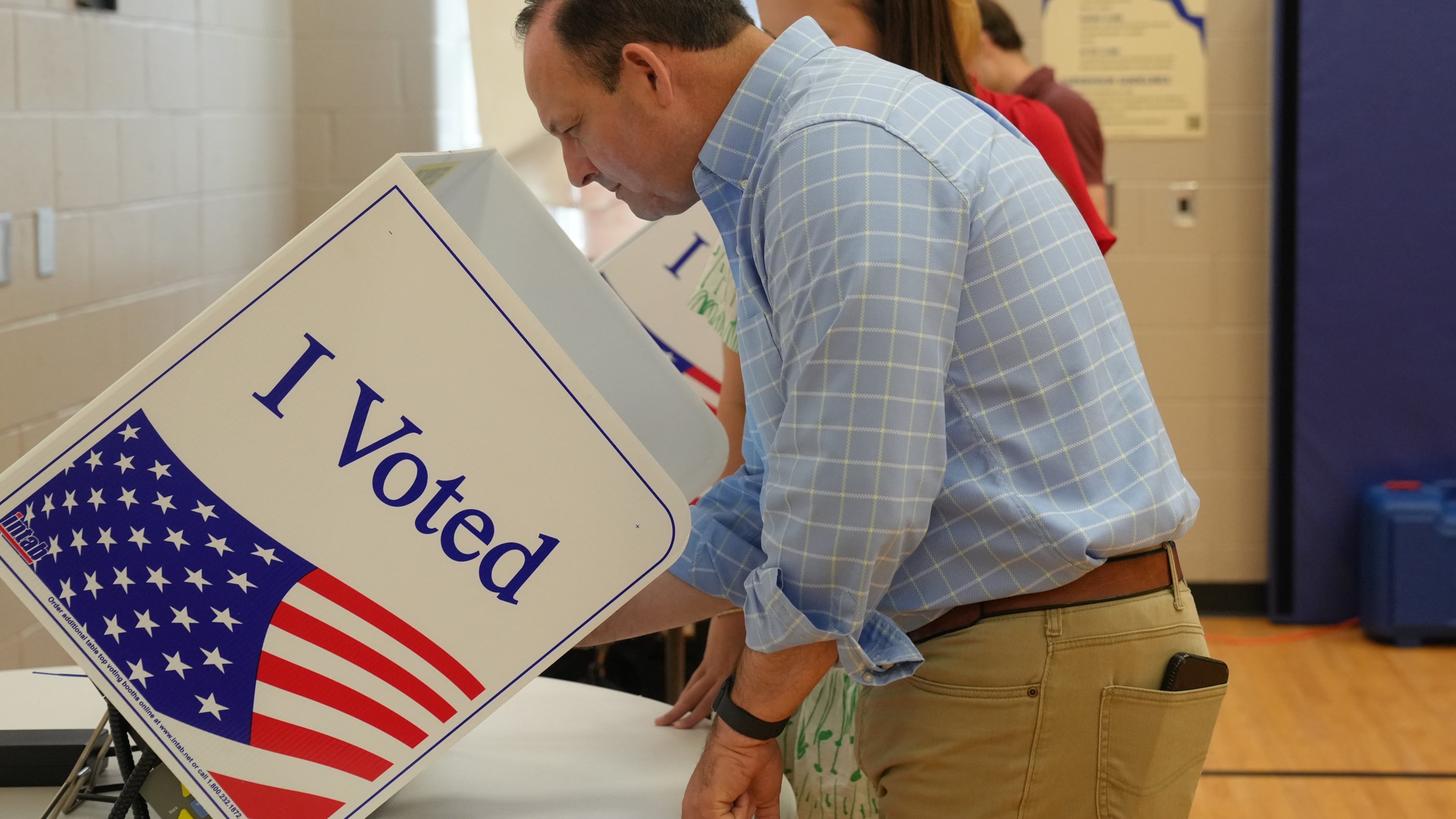 As his teenage daughter looks on, South Carolina Attorney General Alan Wilson, seeking to become the state's next governor, casts his ballot in the Republican primary runoff elections on Tuesday, June 23, 2026, in Lexington, S.C. (AP Photo/Meg Kinnard)