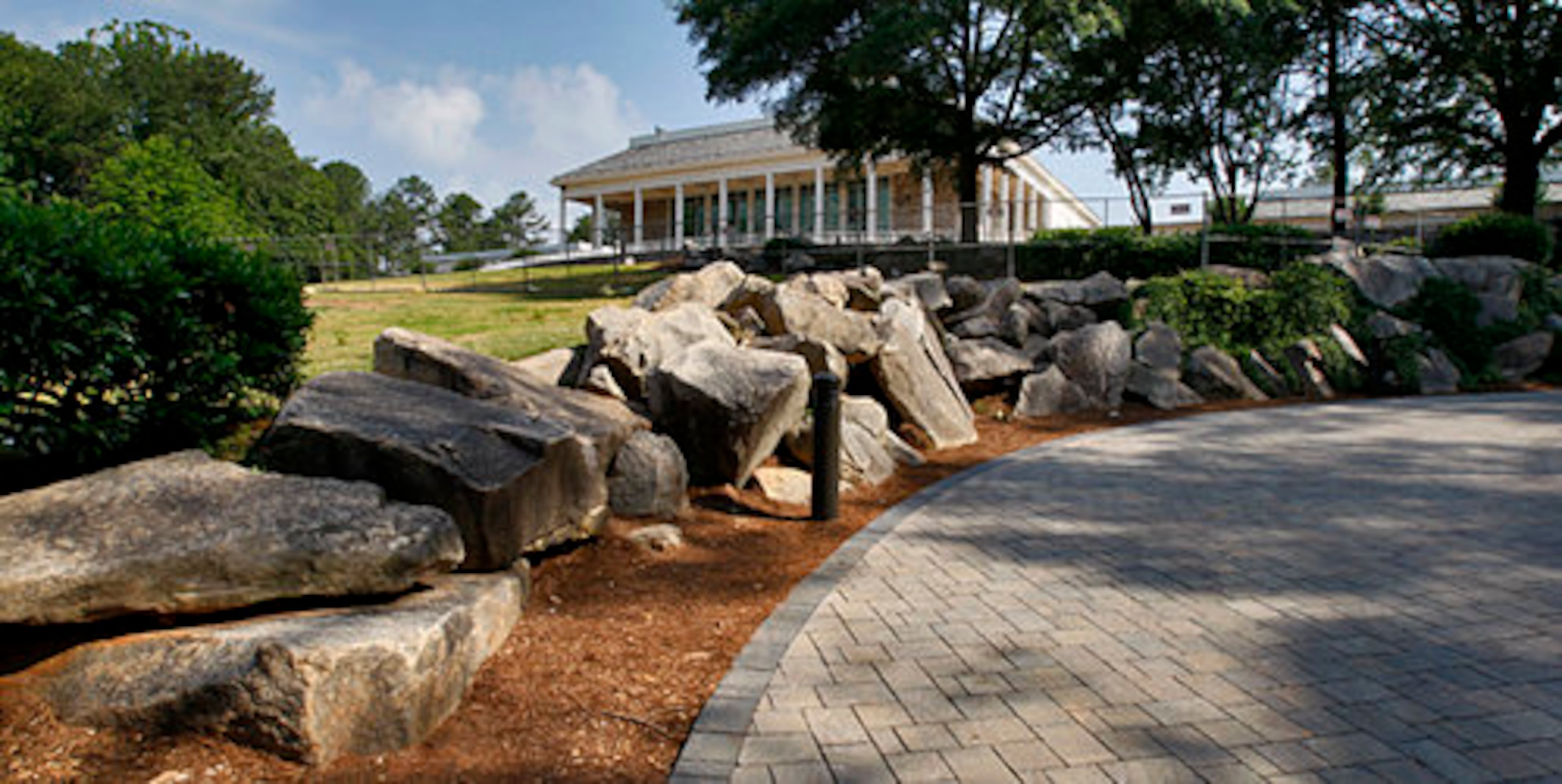 Memorial Hall looms over boulders that have been moved and walk spaces widened with pavers.