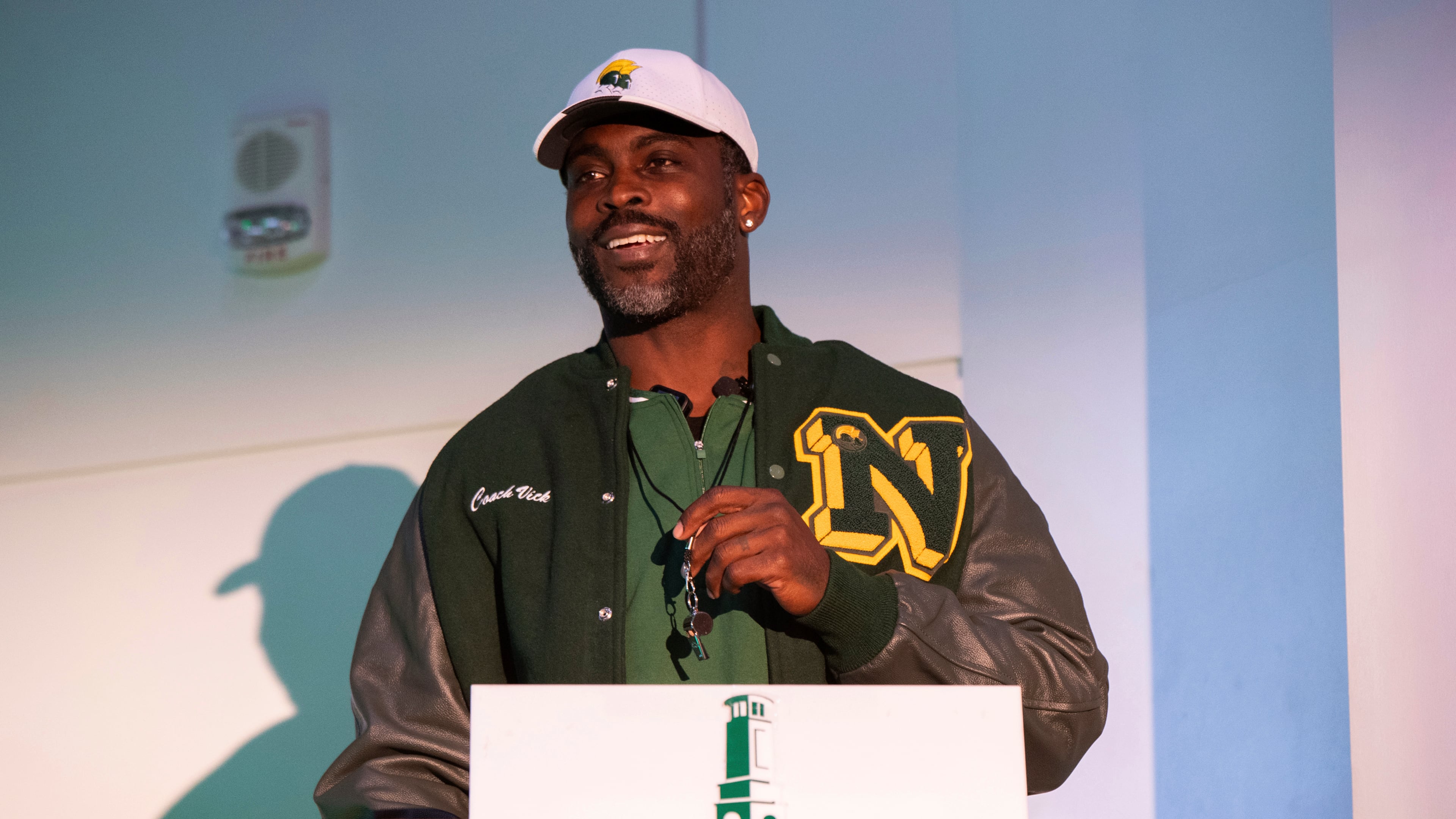 Michael Vick holds a whistle around his neck after he is introduced as the head coach of the Norfolk State football team during a press conference on Monday, Dec. 23, 2024. Vick earned his first Division I win when his team beat Hampton over the weekend. (Mike Caudill/AP)