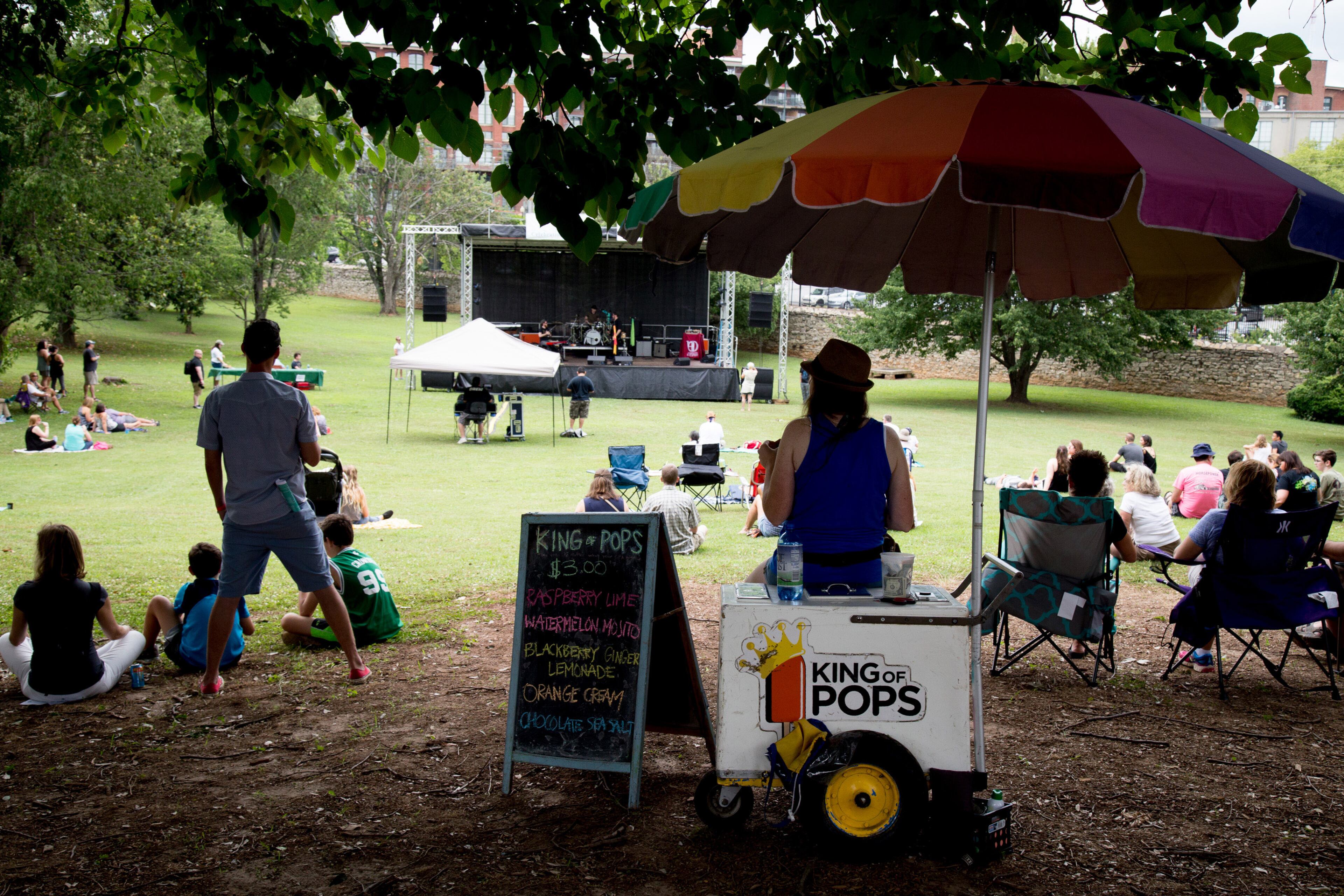 A crowd listens to music at one of the two music stages during the Tunes From The Tombs music festival in Oakland Cemetery Saturday, June 18, 2016, in Atlanta, Ga. STEVE SCHAEFER / SPECIAL TO THE AJC