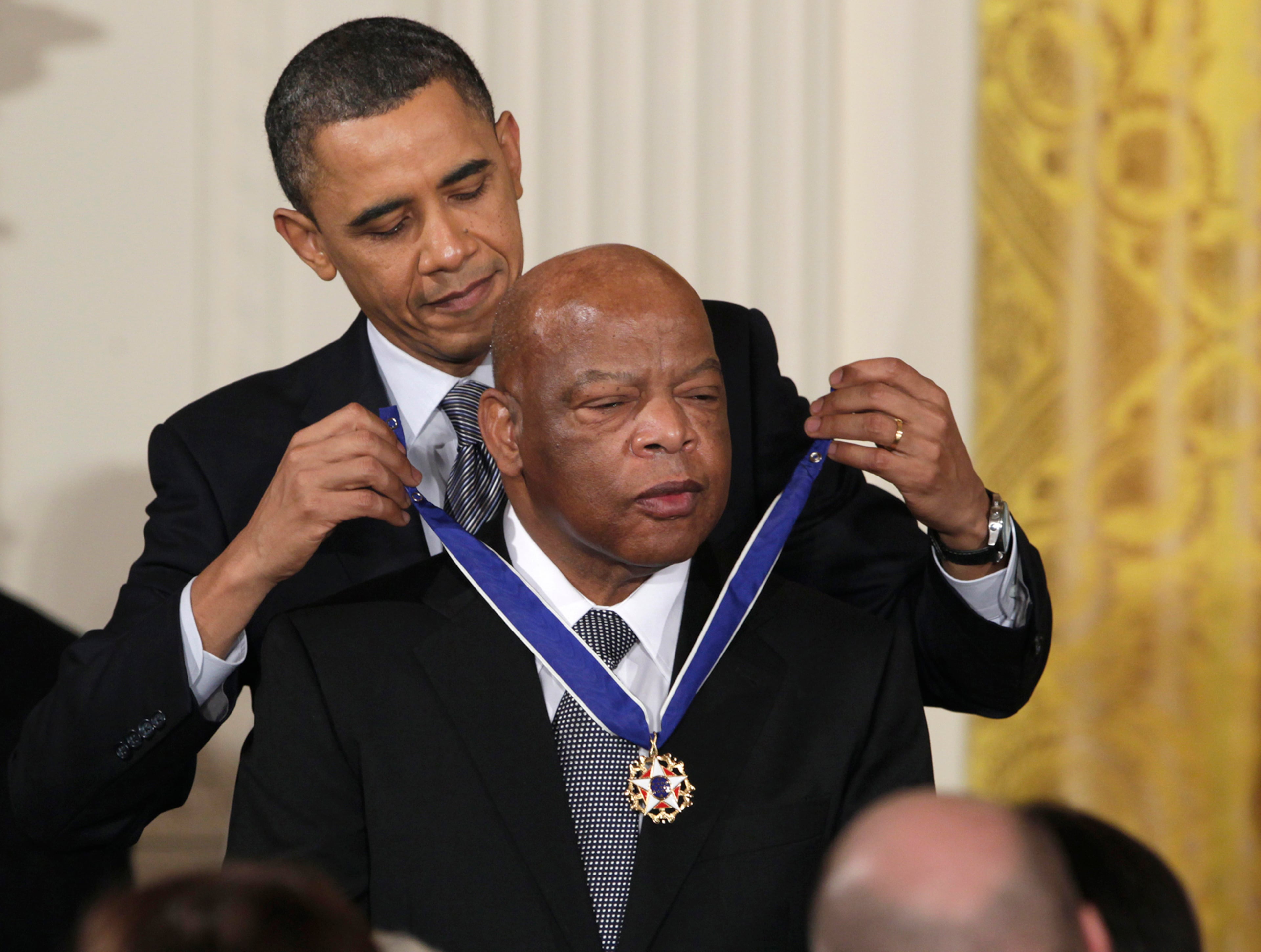 In this Feb. 15, 2011, file photo, President Barack Obama presents a 2010 Presidential Medal of Freedom to Rep. John Lewis, D-Ga., during a ceremony in the East Room of the White House in Washington. Lewis announced Sunday, Dec. 29, 2019, that he has stage IV pancreatic cancer, vowing he will stay in office and fight the disease with the tenacity which he fought racial discrimination and other inequalities since the civil rights era. (Carolyn Kaster, AP File)