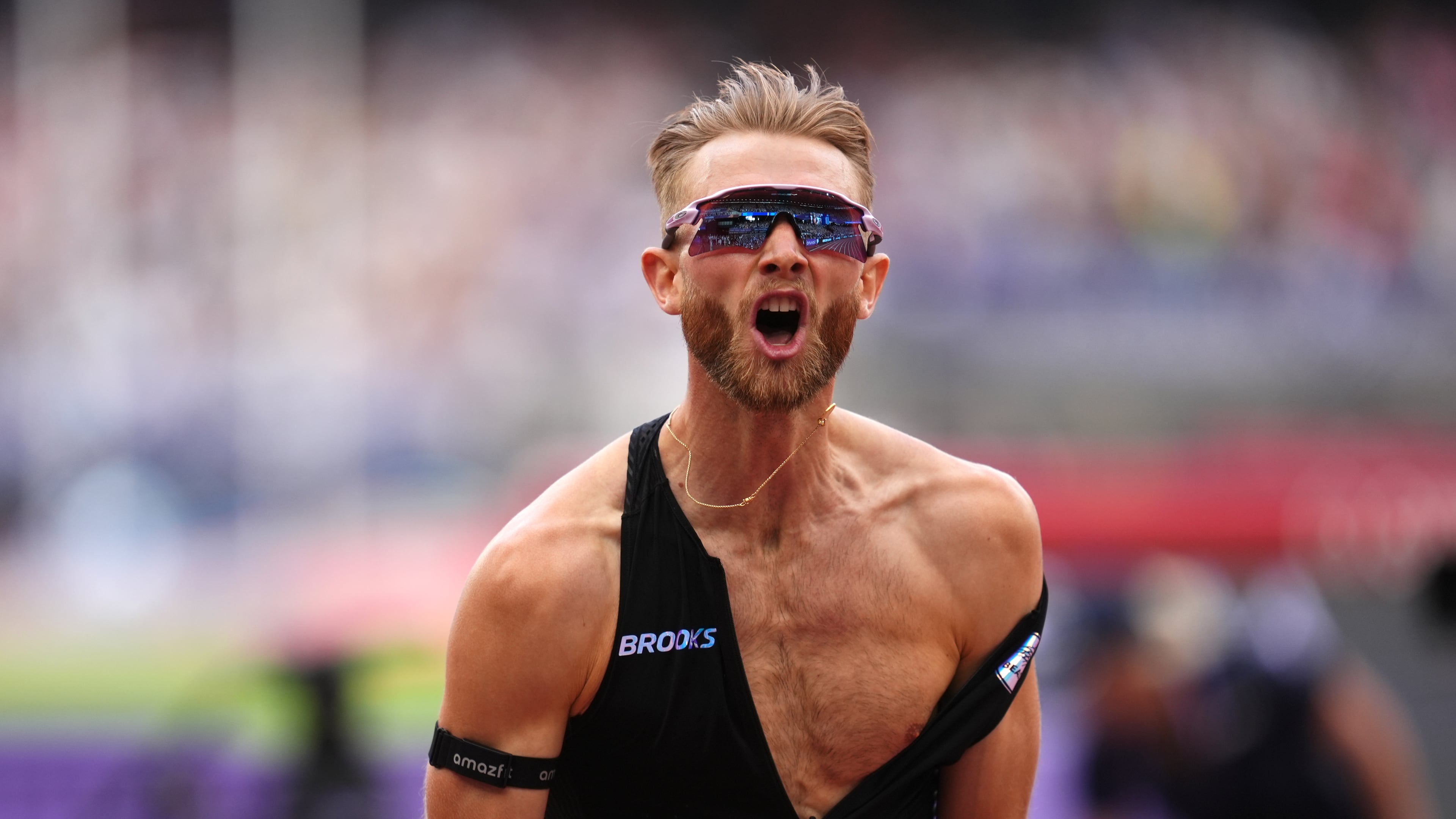 Britain's Josh Kerr celebrates after winning and breaking a world record in the Men's 1 Mile final during the Novuna London Athletics Meet at the London Stadium, Saturday July 18, 2026. (Adam Davy/PA via AP)