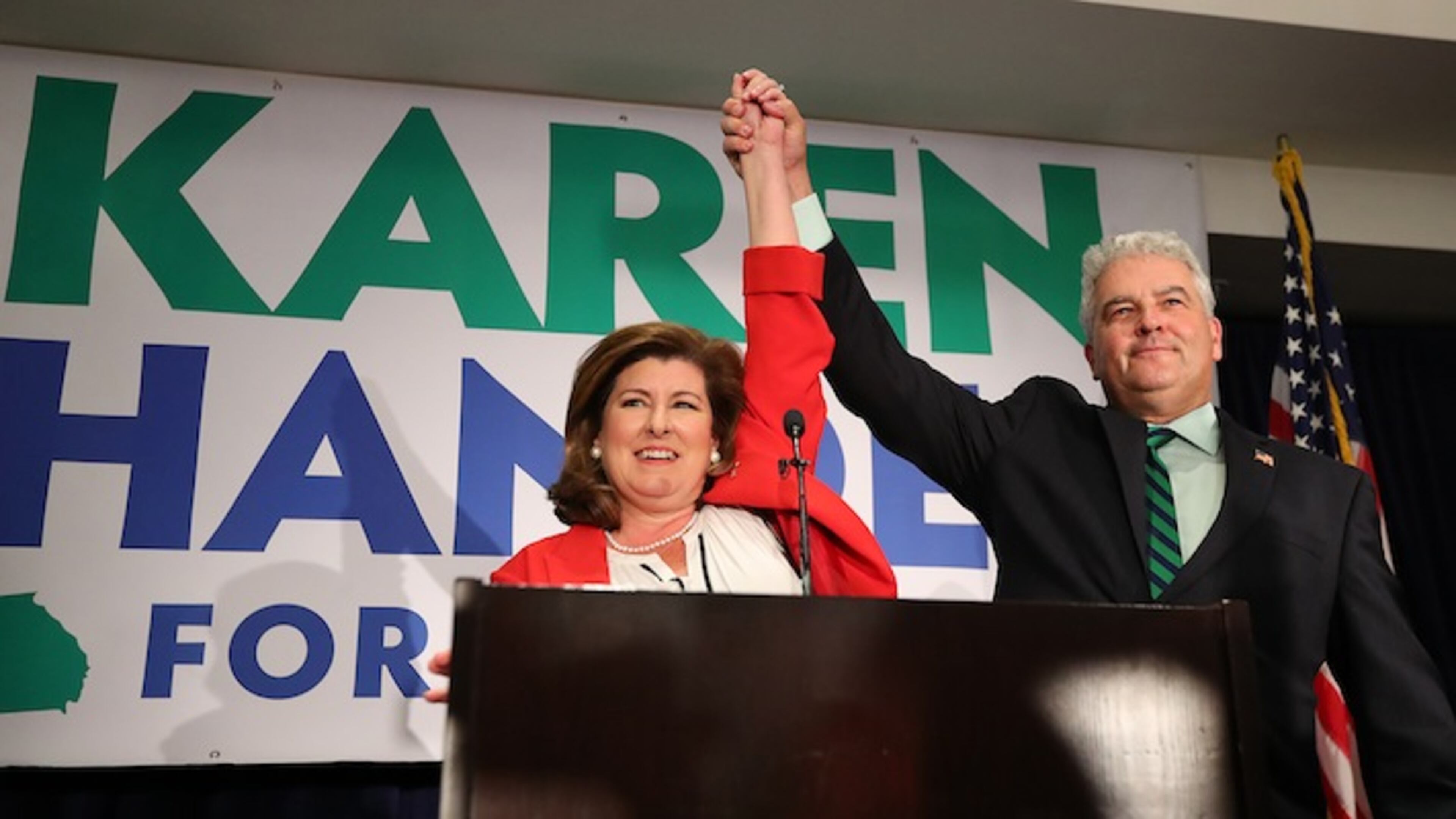 Republican candidate Karen Handel and her husband, Steve, take the podium for her victory speech at her election night party in the 6th District race with Democrat Jon Ossoff on Tuesday, June 20, 2017, in Atlanta. (Curtis Compton/Atlanta Journal-Constitution/TNS)