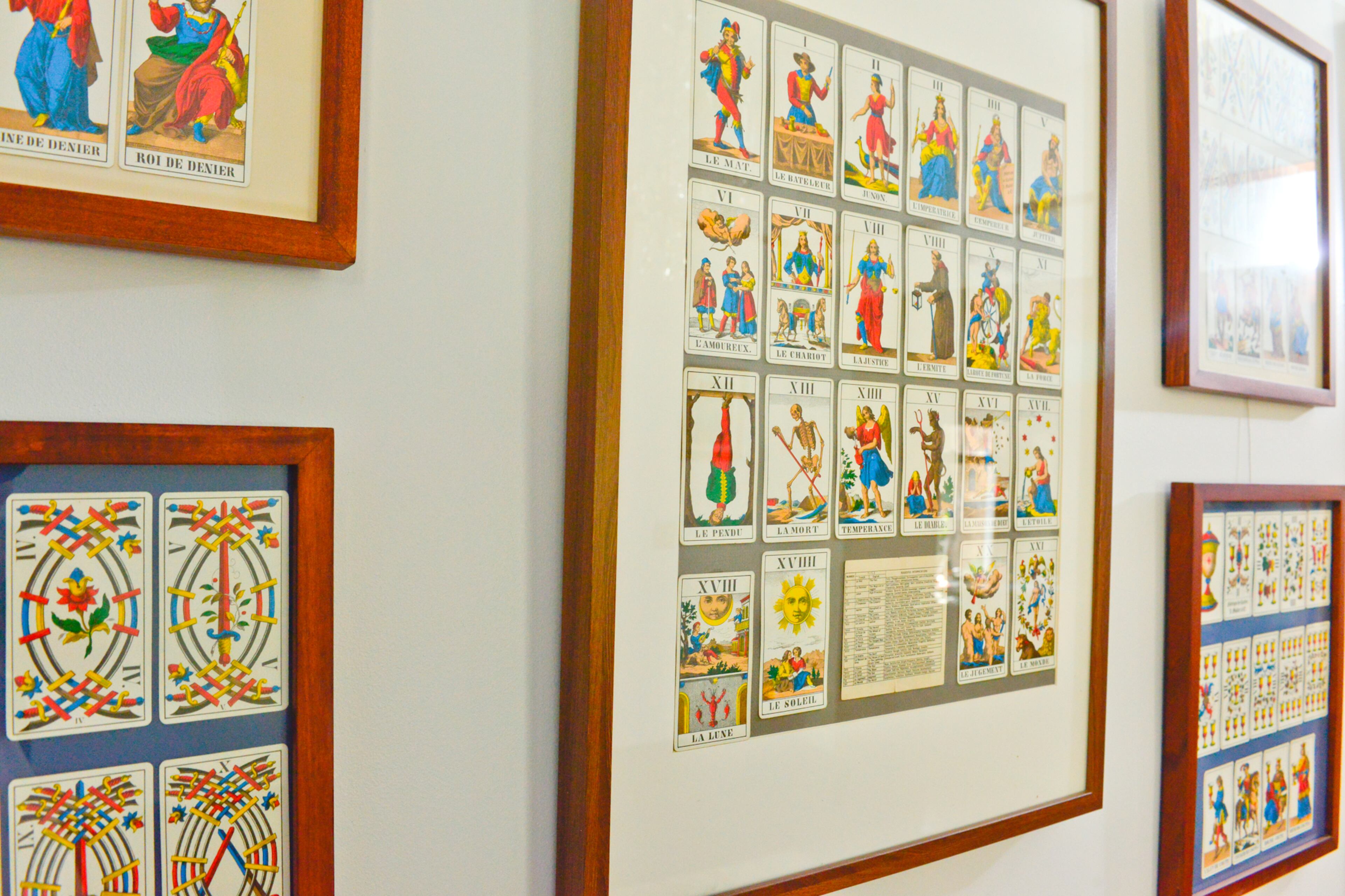 The tarot cards are a Swiss deck that homeowner Bill Goodman's mother found when he was a kid. They sat in a box for years until he saw cards framed at a restaurant and decided to do the same in his home.