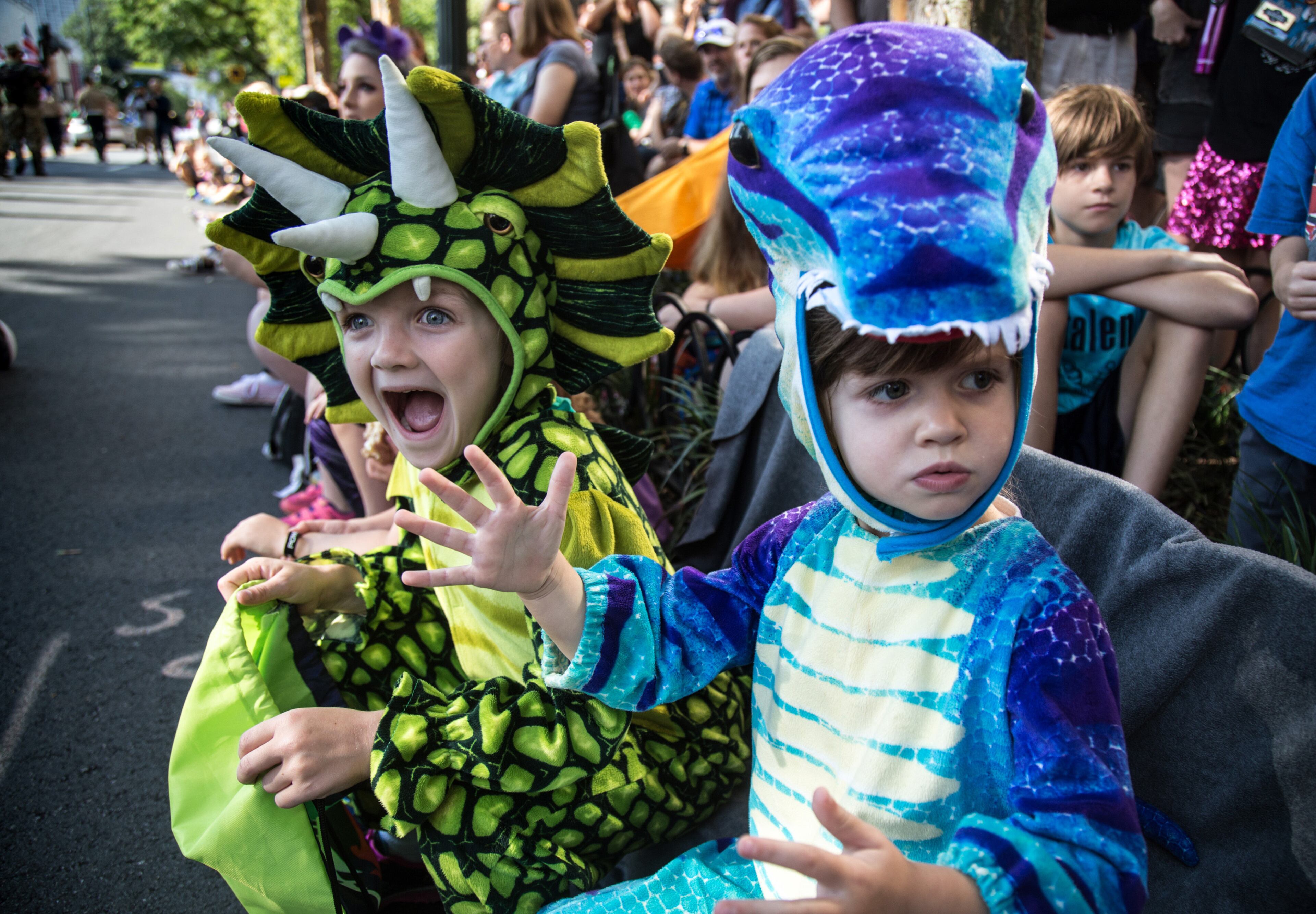 Bella (L) and Brielle Brown look for their favorite characters during the Dragon Con parade in Atlanta GA Saturday, September 2, 2017. Founded in 1987, Dragon Con convention takes place every year over Labor Day weekend. STEVE SCHAEFER / SPECIAL TO THE AJC