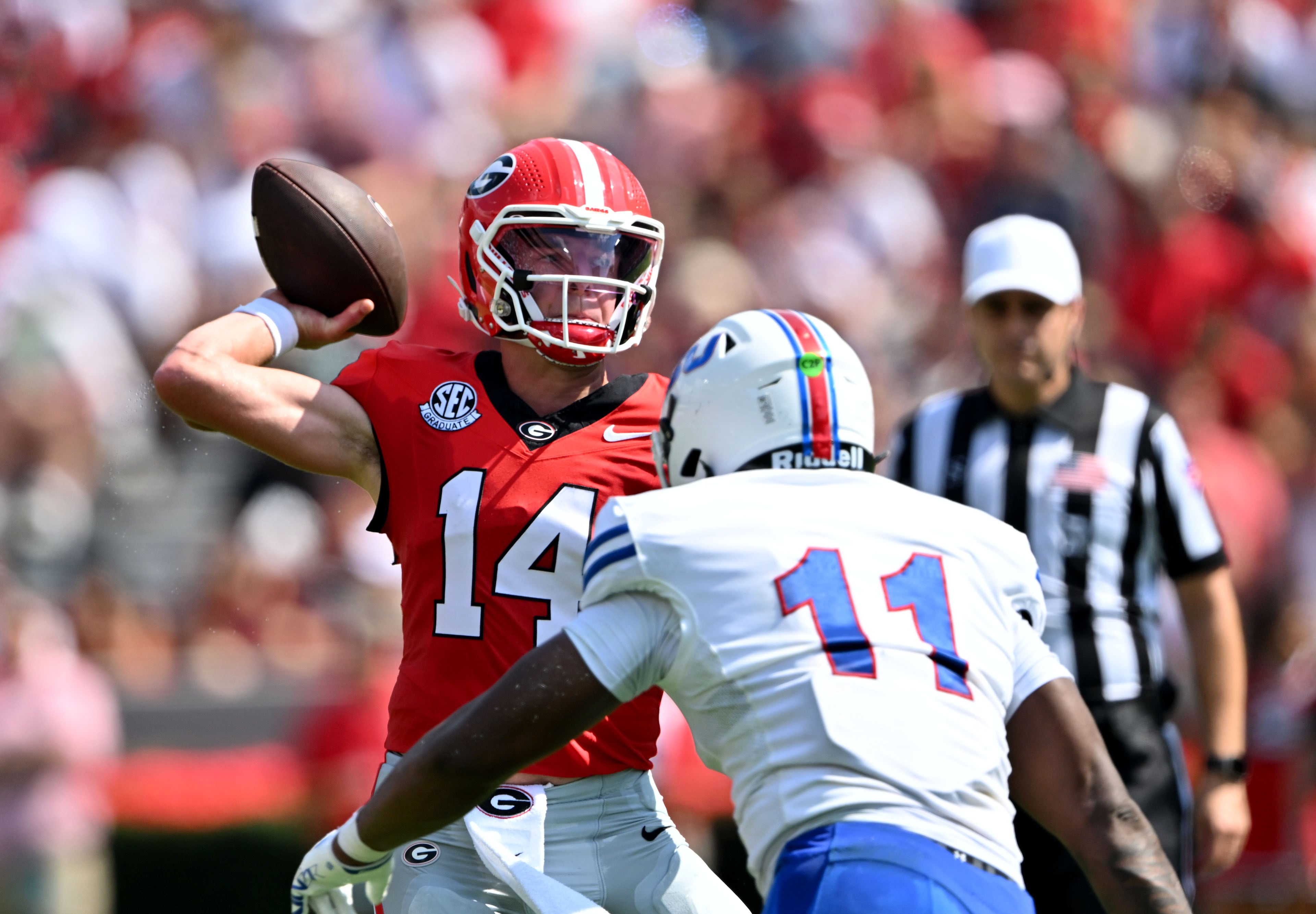 Georgia quarterback Gunner Stockton gets off a pass against Tennessee State linebacker Matthew Wilson during the first half in an NCAA football game at Sanford Stadium on Saturday, Sept. 5, 2026, in Athens, Ga. (Hyosub Shin/AJC)
