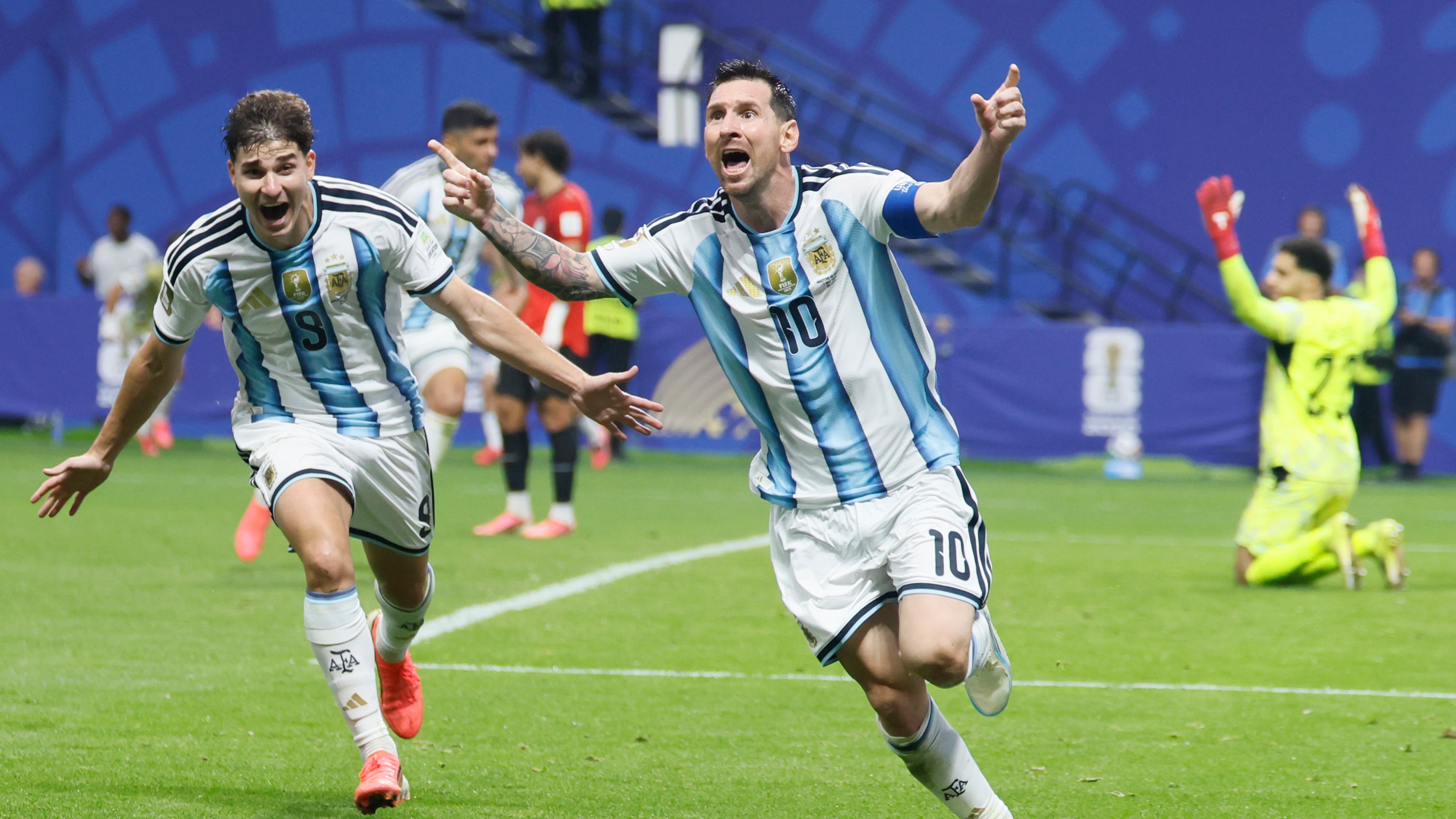 Argentina's Lionel Messi (center) and Julian Alvarez (left) celebrate Messi's game-tying goal while Egypt goalkeeper Mostafa Shobeir kneels on the pitch in the 83rd minute of the Argentina-Egypt FIFA World Cup match at Atlanta Stadium on Tuesday, July 7, 2026. (Miguel Martinez/AJC)
