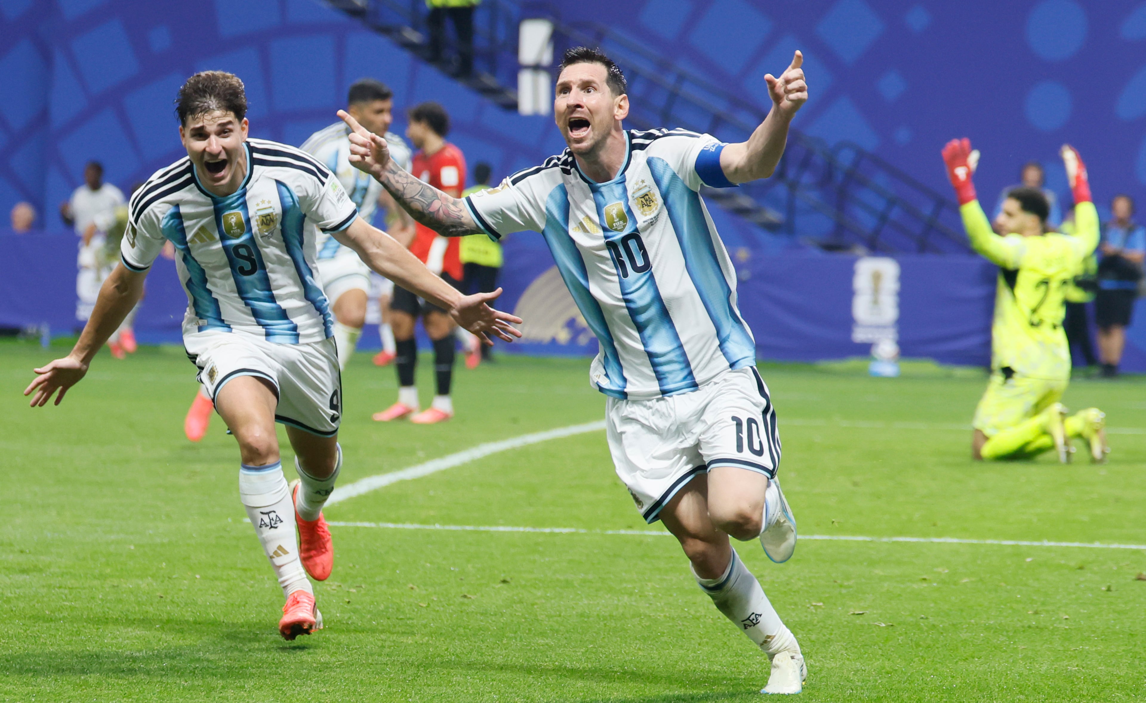 Argentina's Lionel Messi, center, and teammate Julian Alvarez celebrate Messi's goal, while Egypt goalkeeper Mostafa Shoubeir sits frustrated on the pitch during second half of Argentina vs. Egypt FIFA World Cup match at Atlanta Stadium (Mercedes-Benz Stadium) on Tuesday, July 7, 2026. (Miguel Martinez/AJC)