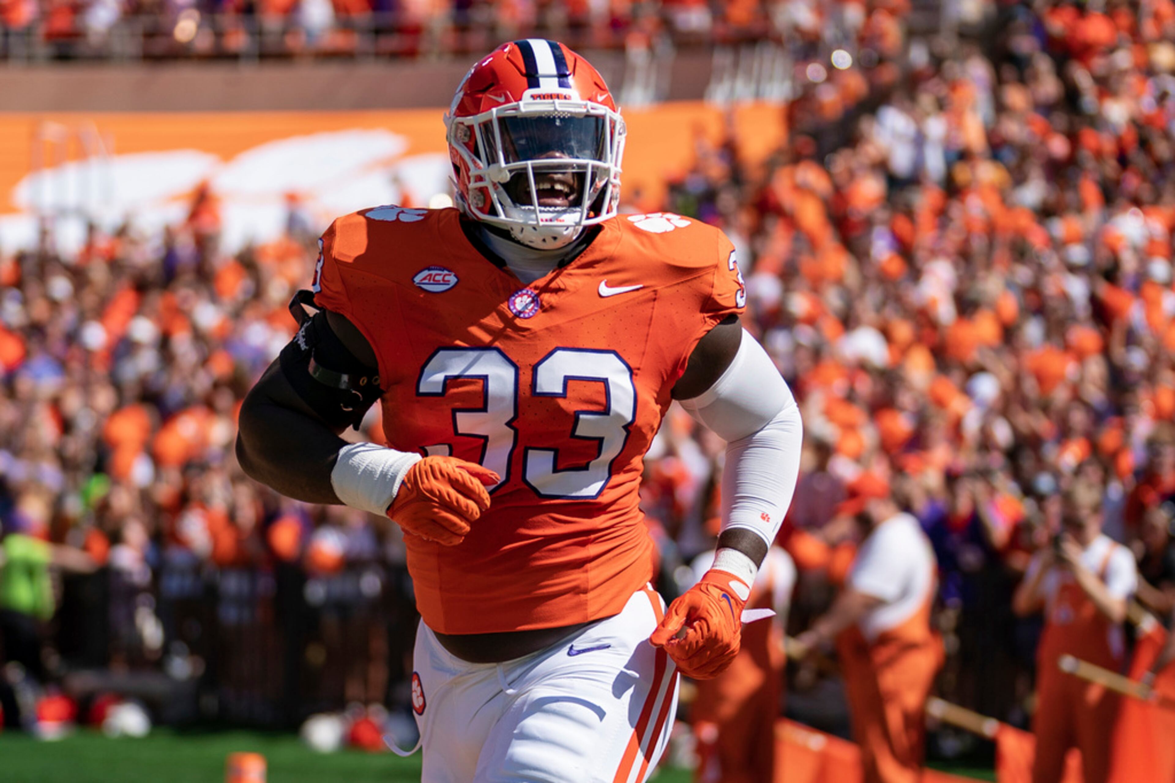 Clemson defensive tackle Ruke Orhorhoro (33) runs onto the field at the start of an NCAA college football game against Florida State Saturday, Sept. 23, 2023, in Clemson, S.C. (AP Photo/Jacob Kupferman)
