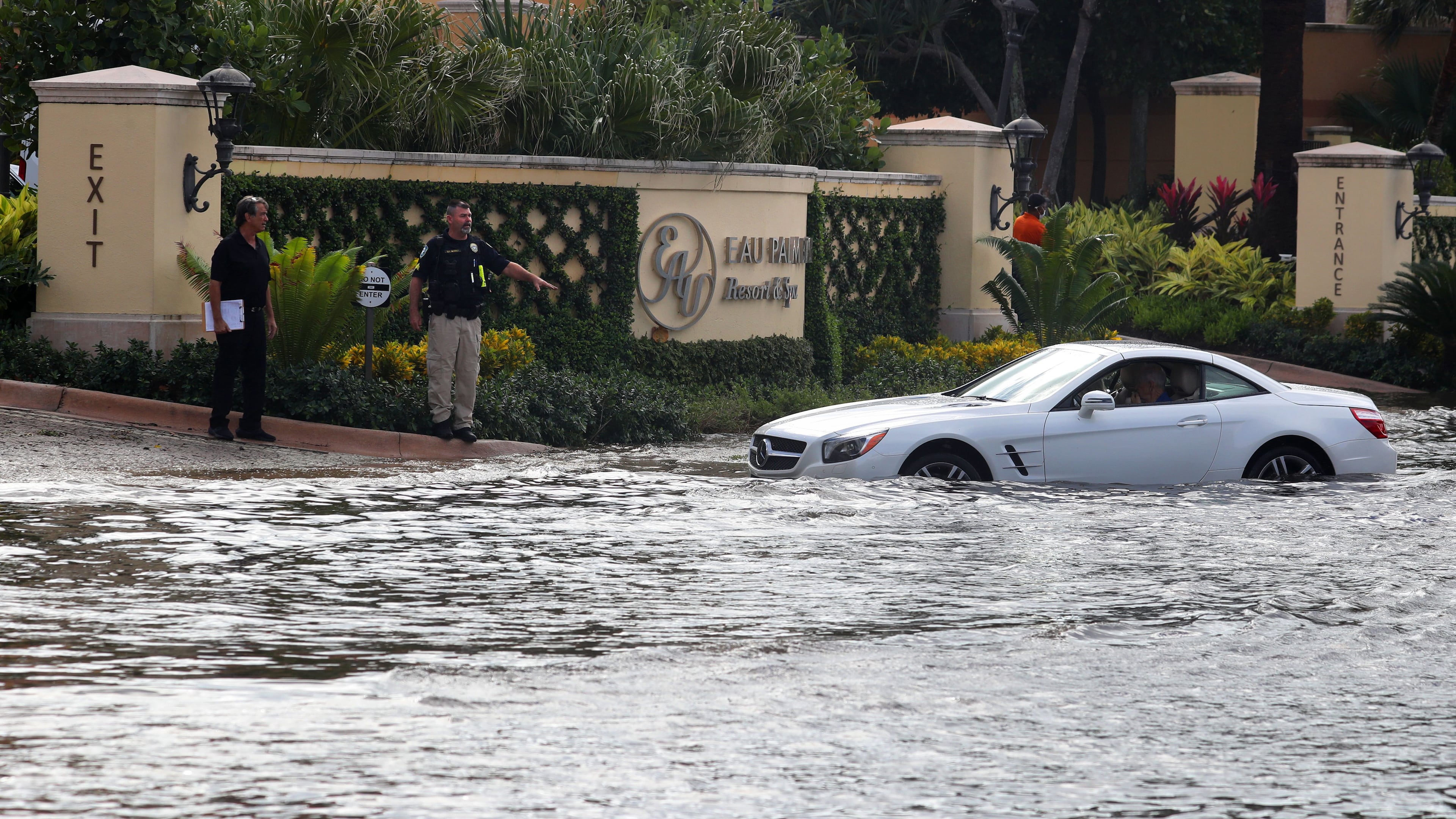 A car broke down on State Road A1A in Manalapan, Florida, with the roads flooded from Hurricane Nicole on Thursday, Nov. 10, 2022. Nicole has since been downgraded to a Tropical Storm as it churns across the state. (Mike Stocker/South Florida Sun-Sentinel/TNS)