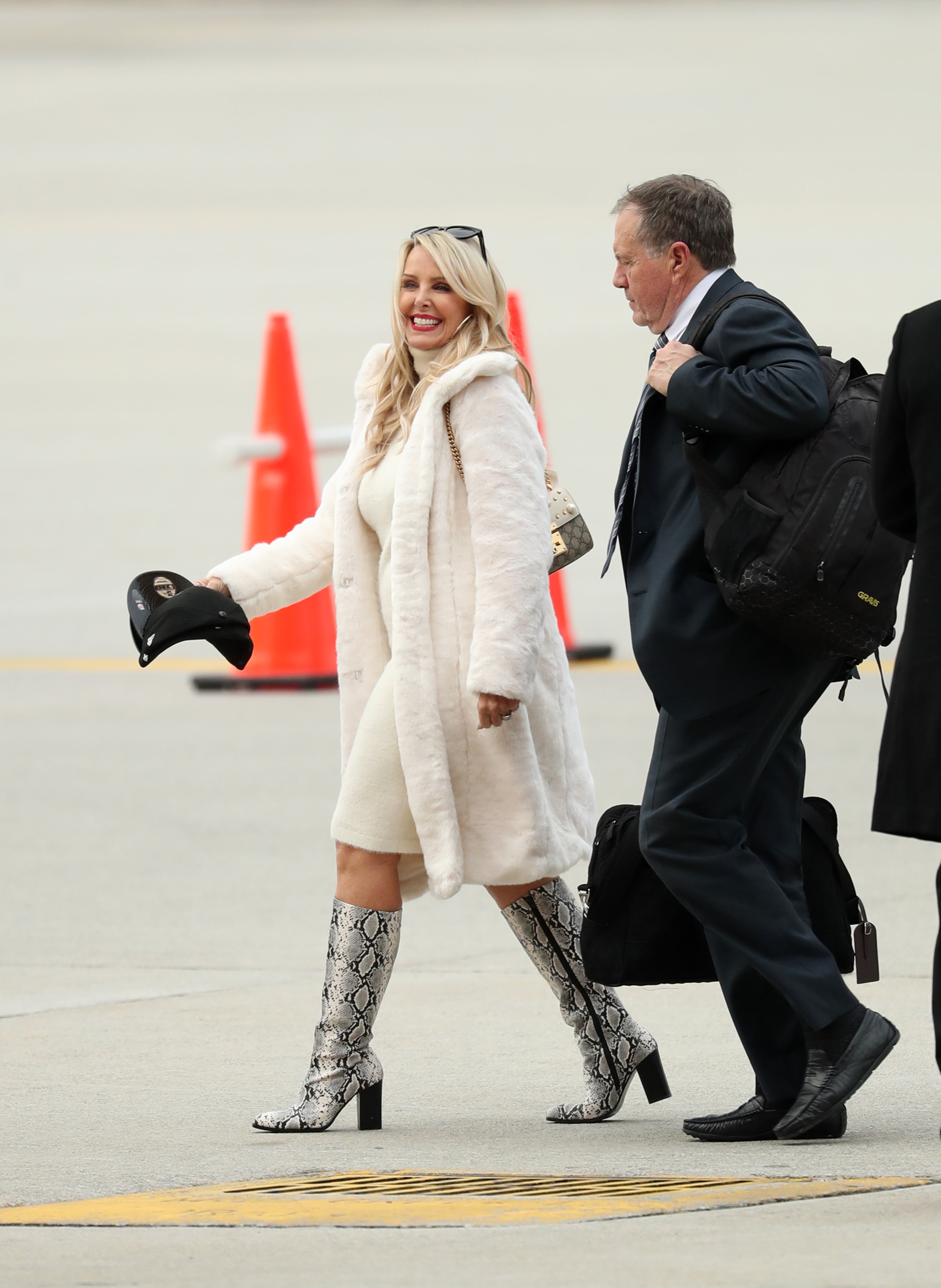 January 27, 2019 - Atlanta, Ga: New England Patriots head coach Bill Belichick, right, and his girlfriend Linda Holliday arrive in advance of Super Bowl LIII at Hartsfield-Jackson Atlanta International Airport Sunday, January 27, 2019 in Atlanta. (JASON GETZ/SPECIAL TO THE AJC)