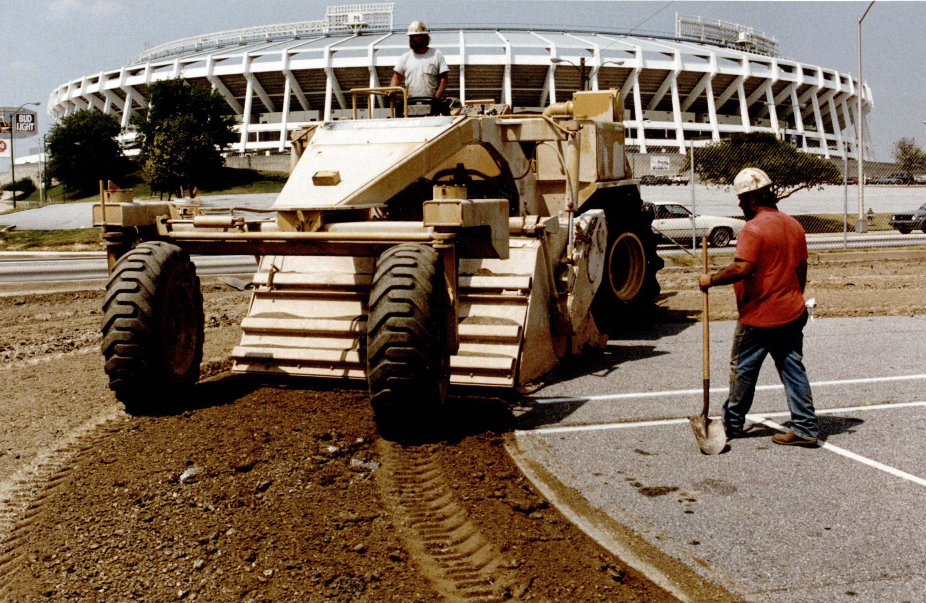 Colby Pomenter and Mike Bannister pulverize asphalt to prepare the Olympic Stadium construction site, July 30, 1993