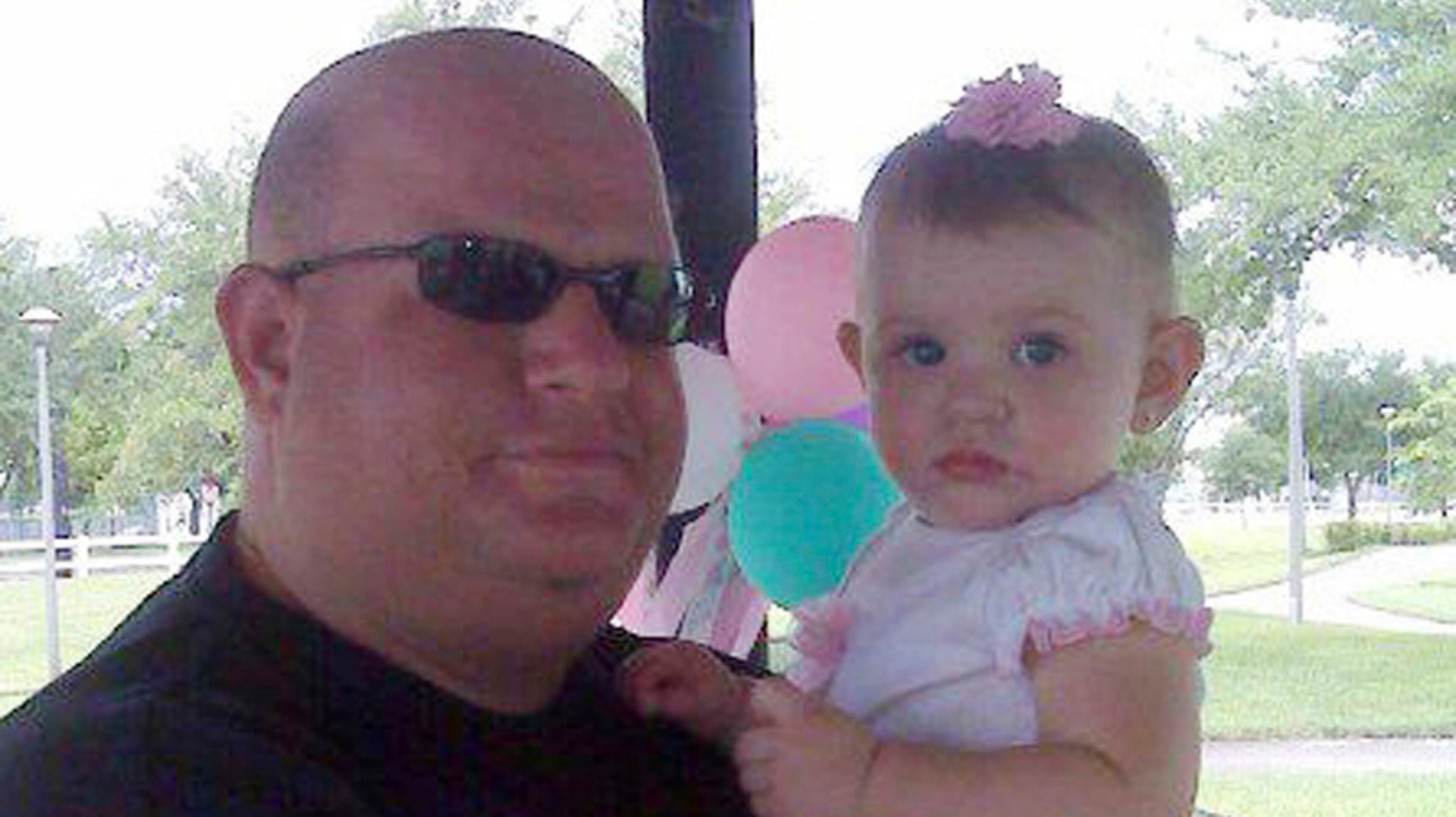 This photo taken from the Facebook page of Aaron Feis shows him with an unidentified girl. Feis, a football coach at Marjory Stonemason Douglas High School in Parkland, Fla., was fatally shot when former student Nikolas Cruz opened fire at the school on Wednesday, Feb. 14, 2018. (Facebook via AP)