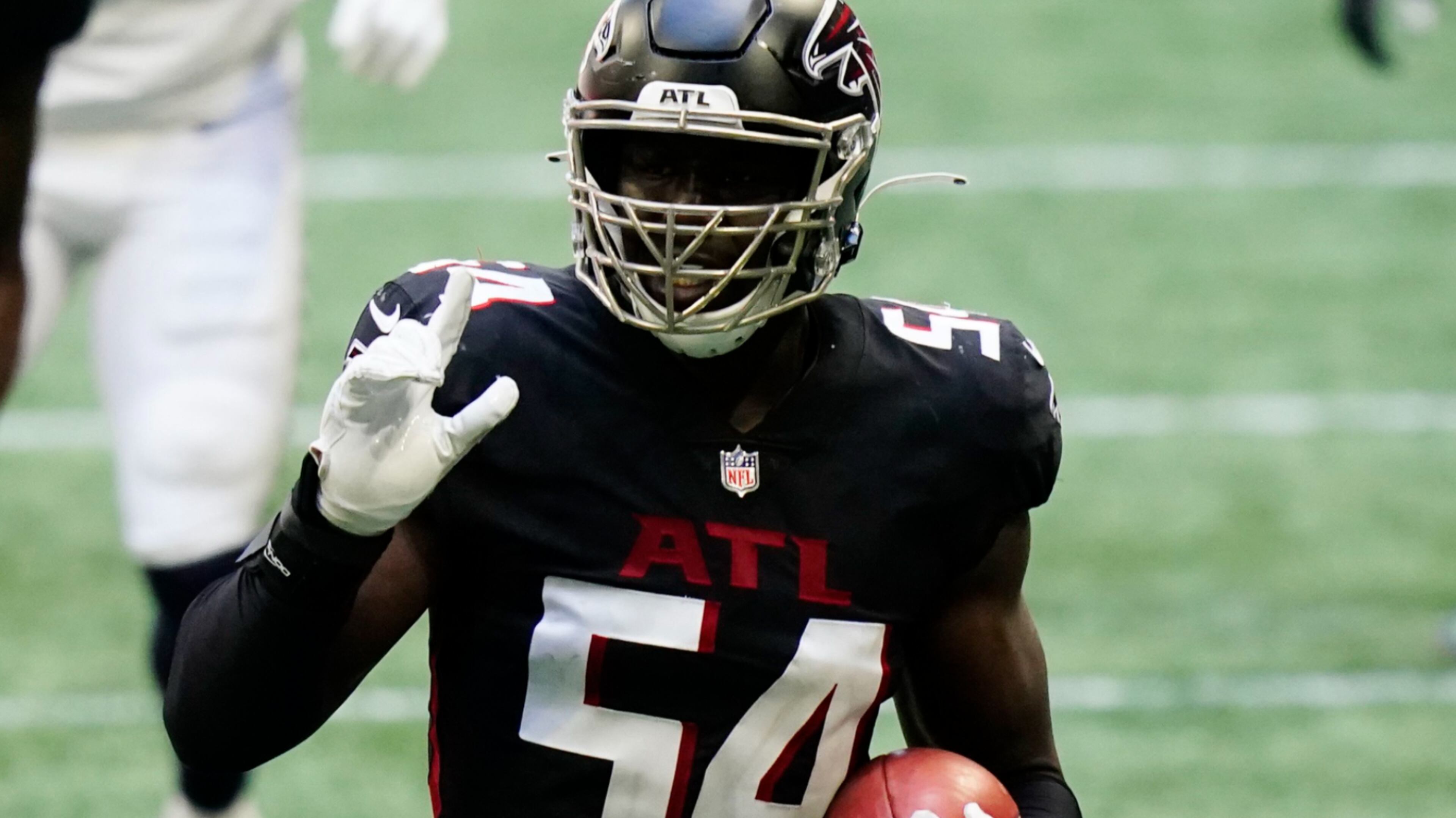 Atlanta Falcons linebacker Foye Oluokun (54) picks up an on-side kick against the Seattle Seahawks during the second half Sunday, Sept. 13, 2020, in Atlanta. (Brynn Anderson/AP)