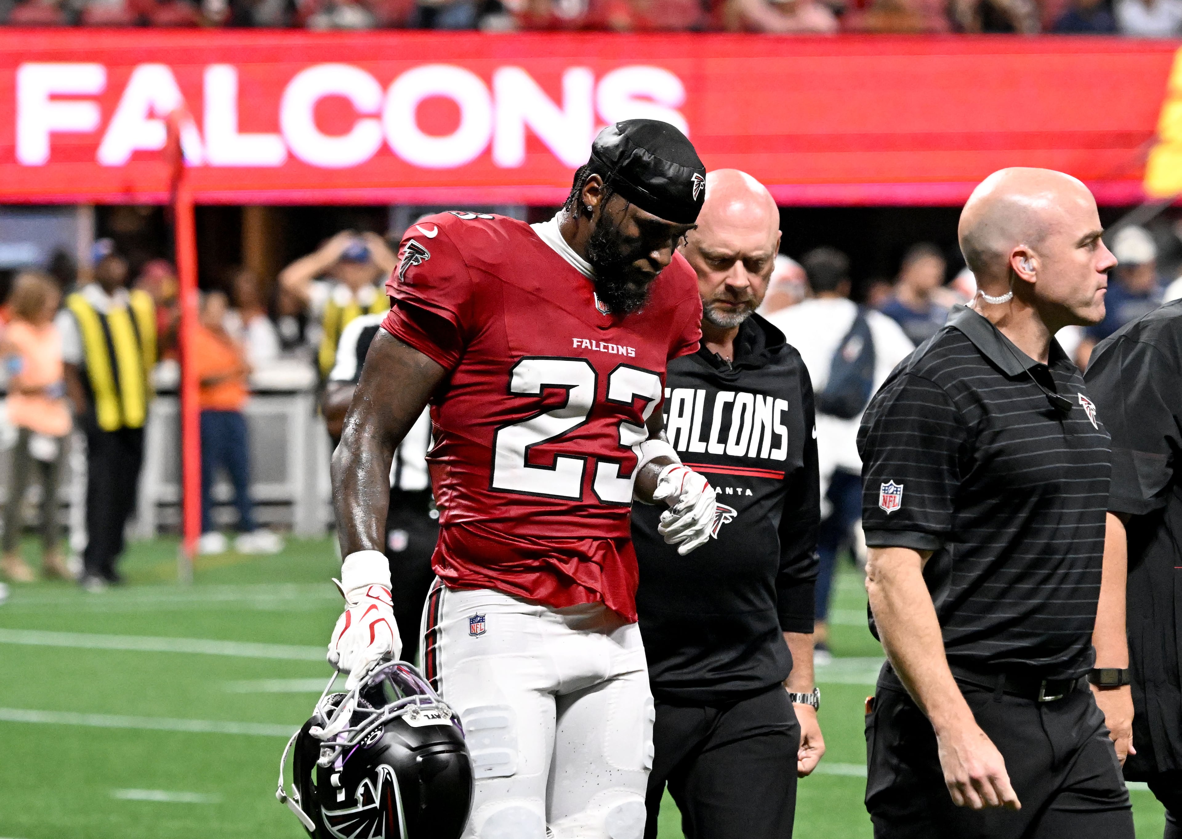 Falcons safety DeMarcco Hellams leaves their preseason game against the Denver Broncos after getting injured at Mercedes-Benz Stadium on Friday, Aug. 14, 2026, in Atlanta. (Hyosub Shin/AJC)