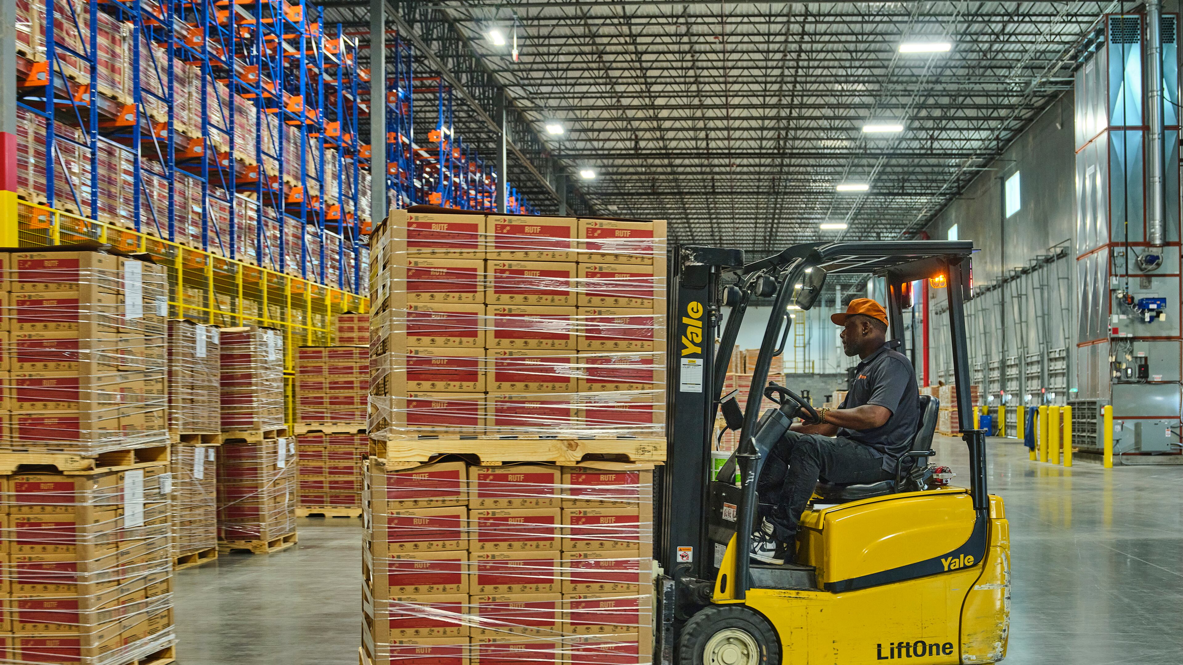 Since March, Georgia-based Mana Nutrition has accumulated about 300,000 boxes of therapeutic food in its warehouse near Savannah, said Mark Moore, the organization’s co-founder and CEO. Each box includes 150 food packets, enough to feed a child for six weeks. Mana’s supply is awaiting shipment to countries in sub-Saharan Africa. “No one is being served by it sitting here,” Moore said. “It is just the sort of sadness of: Why would we not have it out there?” (Matt Odom for Mana Nutrition)