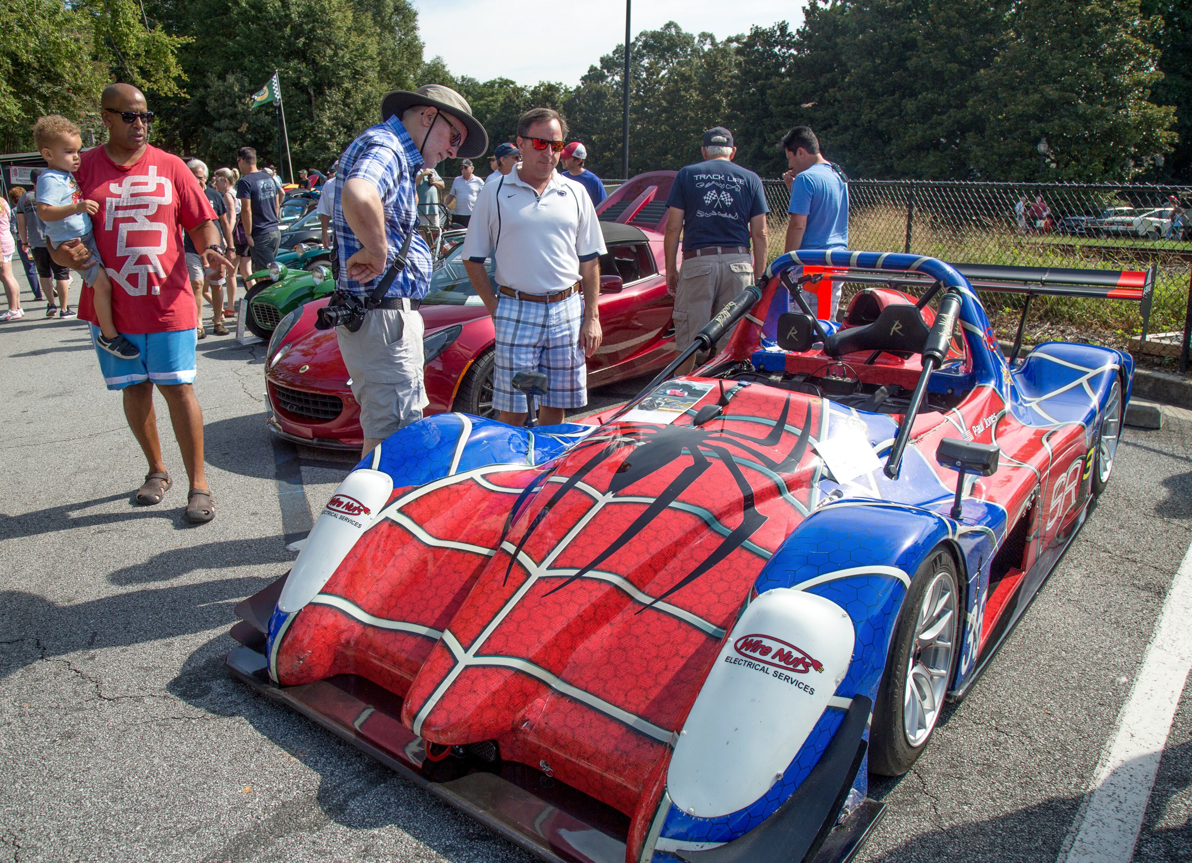 Phil Roberts (left) and Bryon Cipriani look over a 2013 Radical SR3 during the 8th annual Atlanta British Car Fayre in downtown Norcross on Saturday, Sept. 8, 2018. The British Car Fayre featured more than 400 British automobiles and motorcycles. (Photo: STEVE SCHAEFER / SPECIAL TO THE AJC)