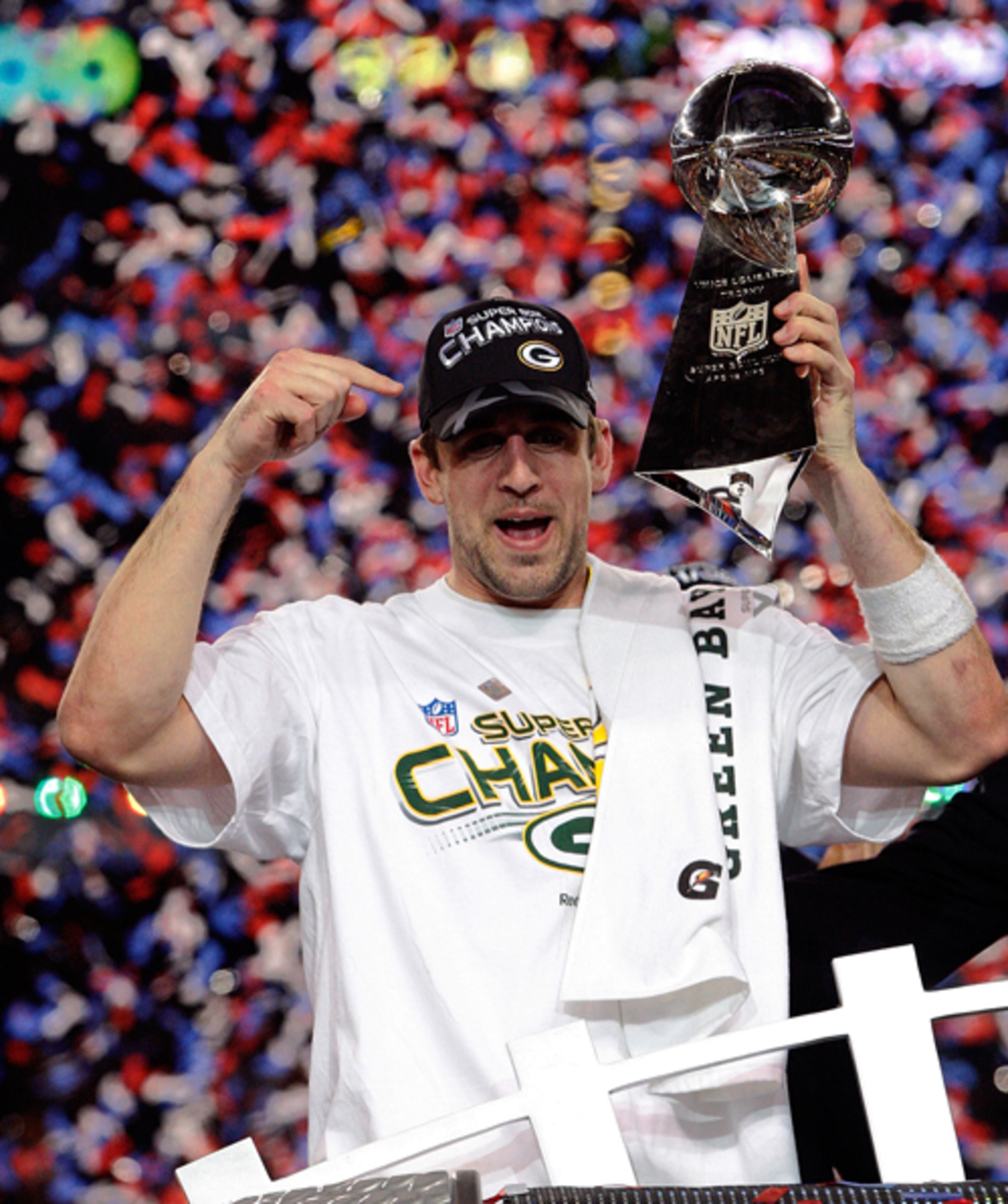 Green Bay Packers quarterback Aaron Rodgers hoists the Lombardi Trophy at the end of Super Bowl XLV where the Green Bay Packers beat the Pittsburgh Steelers 31-25 at Cowboys Stadium in Arlington, Texas, Sunday, Feb. 6, 2011.