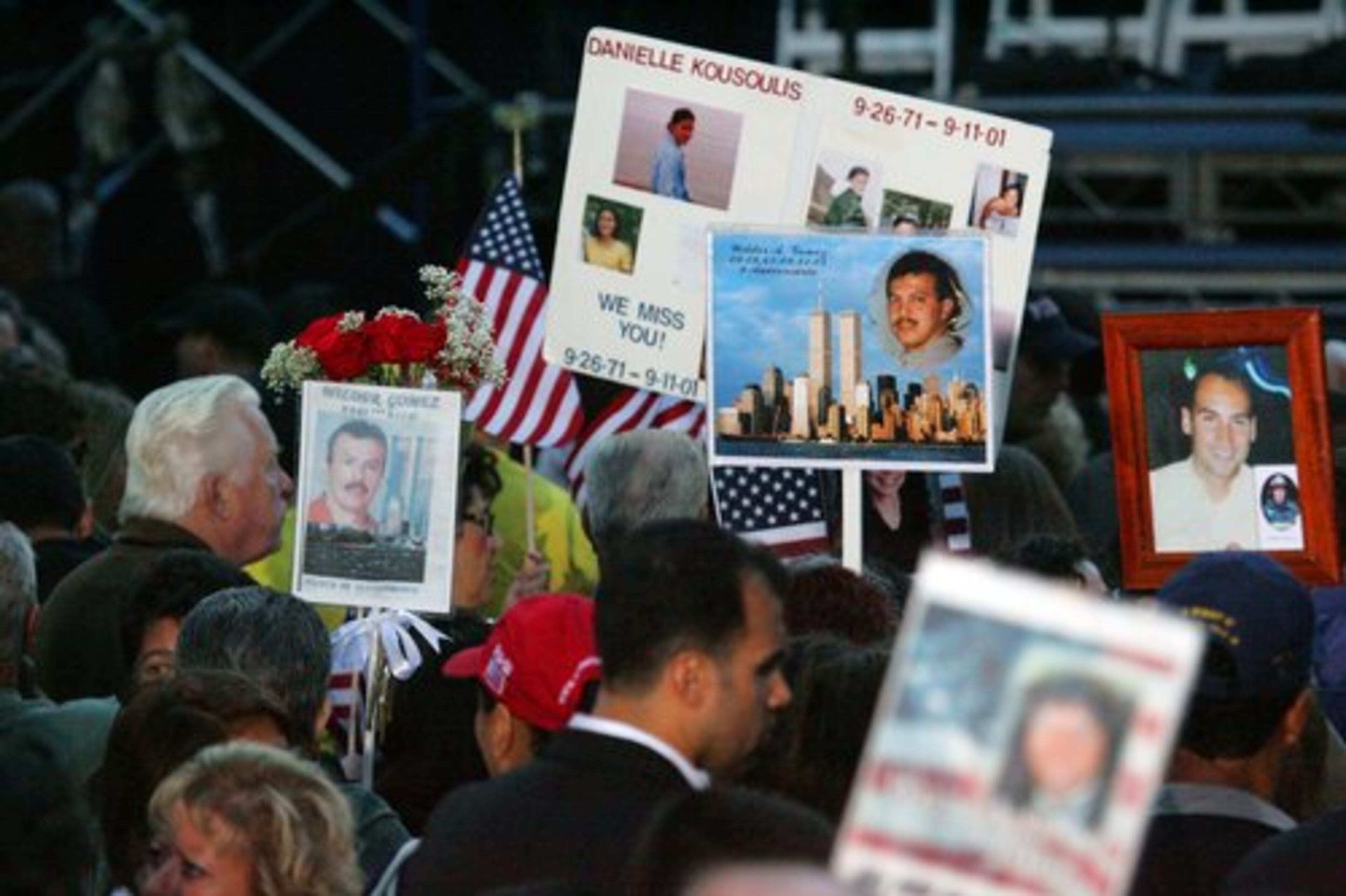 Posters commemorating those who died are seen at Zuccotti Park where families and friends of those who died gathered to hear the names of those who died read aloud.