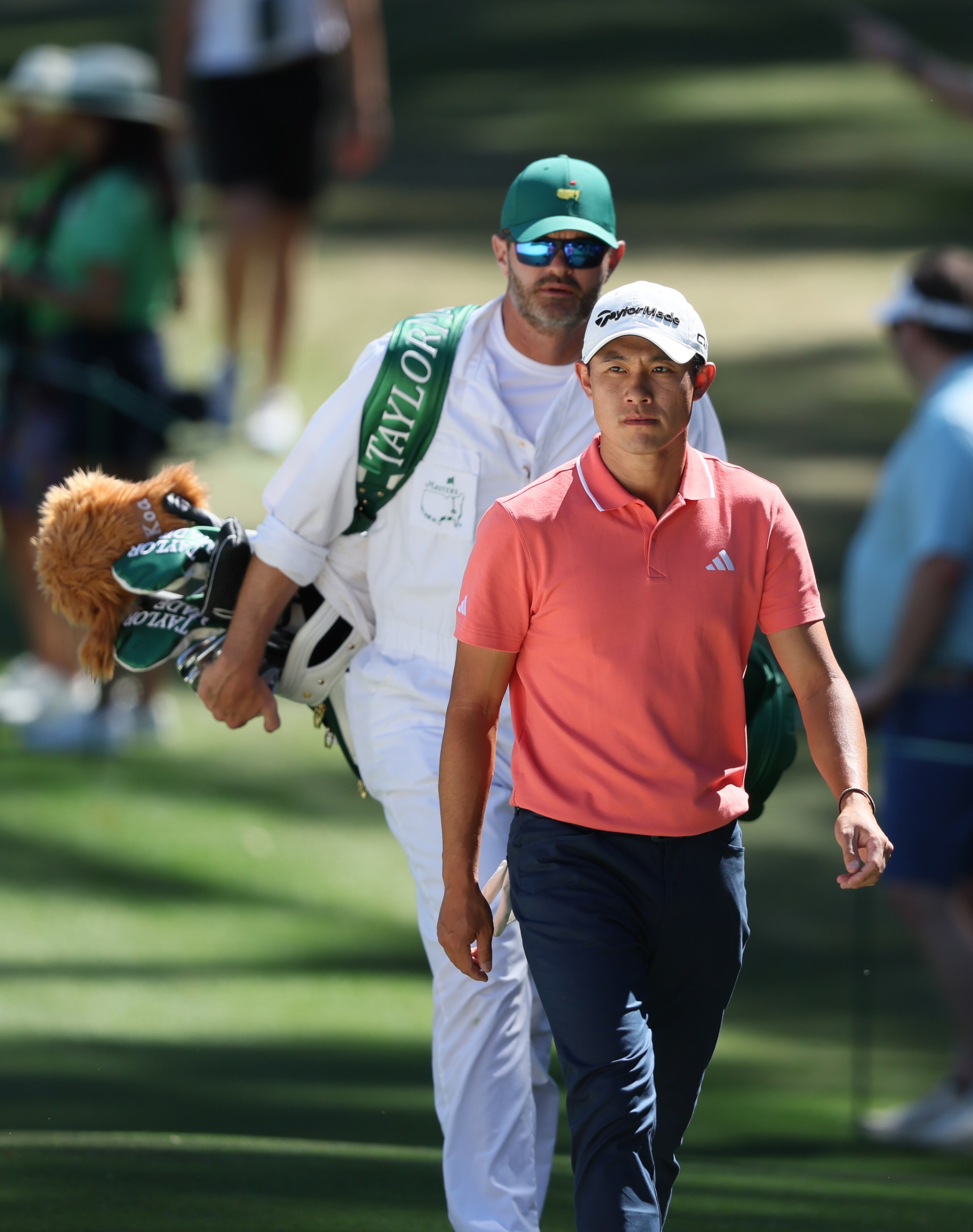 Collin Morikawa walks sixth fairway with caddie Jonathan Jakovac during third round at the 2024 Masters Tournament at Augusta National Golf Club, Saturday, April 13, 2024, in Augusta, Ga. Jason Getz / Jason.Getz@ajc.com)