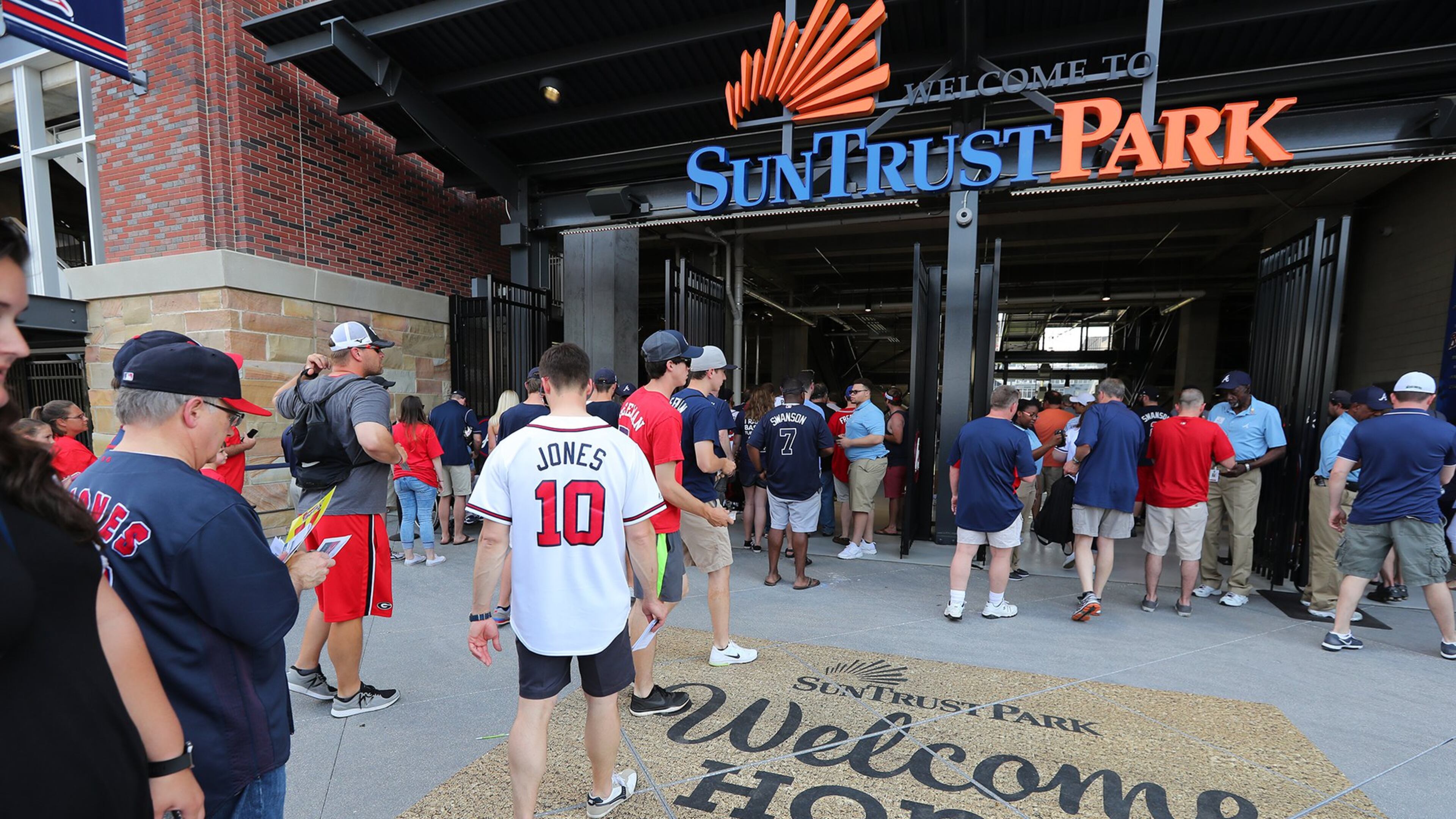 Fans enter the third base gate for the Braves home opener in their new stadium at SunTrust Park on Friday, April 14, 2017, in Atlanta. CURTIS COMPTON/CURTIS.COMPTON@AJC.COM
