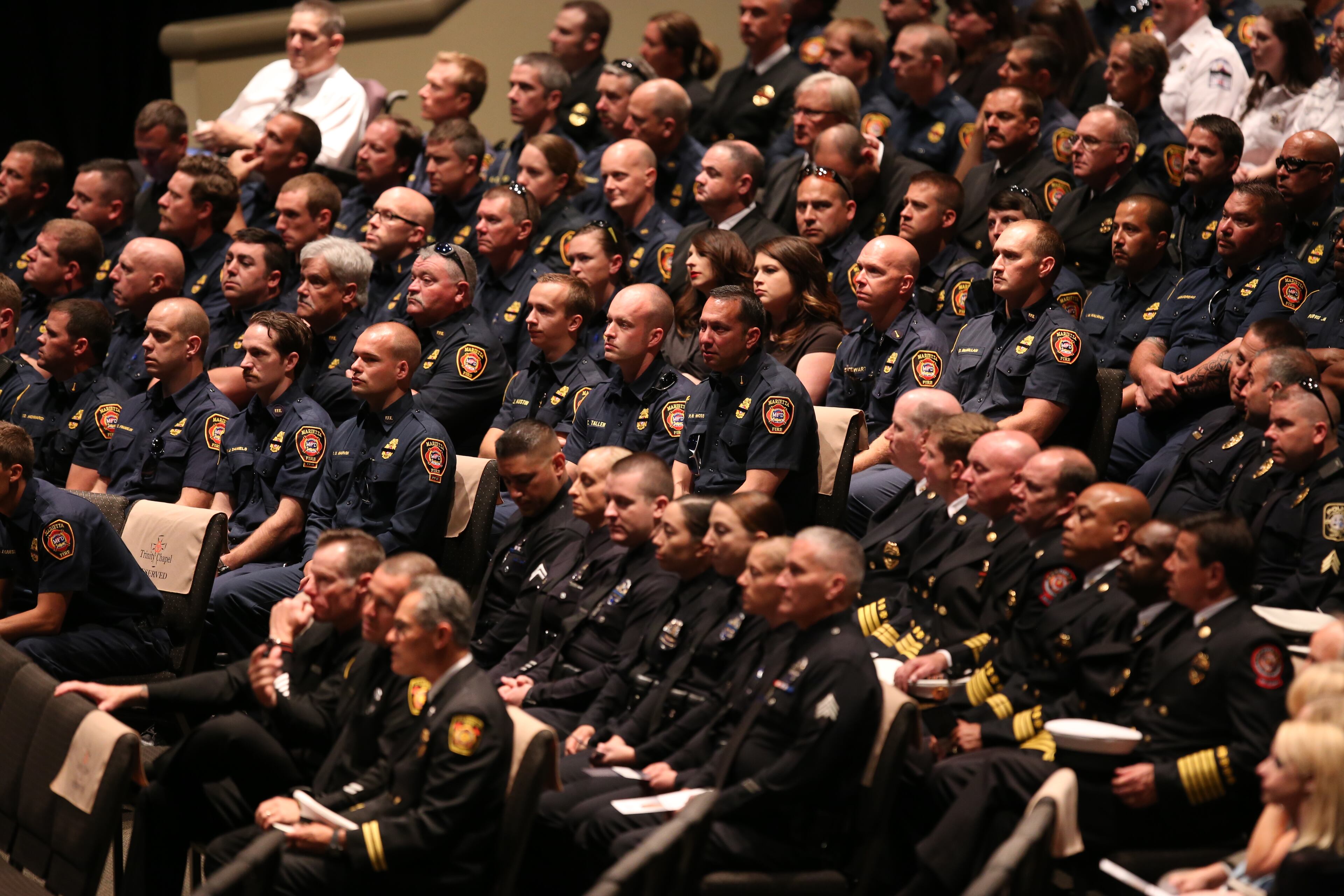 April 19, 2017, Atlanta, Georgia - A large portion of the Marietta Fire Department and Marietta Police Department sit in far right rows at Trinity Chapel in Powder Springs, Georgia, on April 19, 2017. A Celebration of Life funeral service was held for Marietta Fire Fighter Ron Herens, who died in a traffic accident while on vacation in Los Angeles last week. (HENRY TAYLOR / HENRY.TAYLOR@AJC.COM)