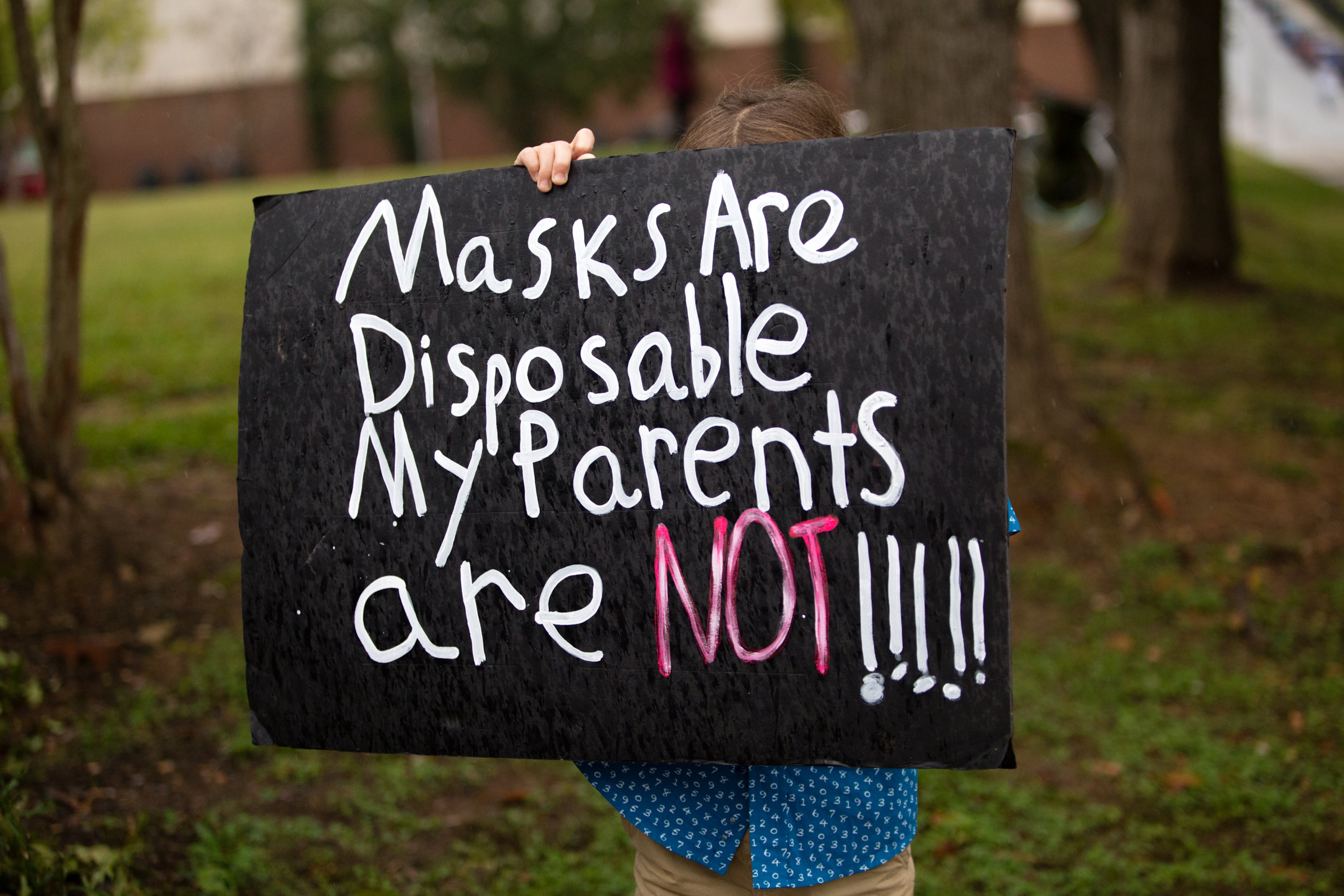 Teachers, parents and students protest in front of the Decatur City School Headquarters on Trinity Place in response to the district's plan to return teachers to schools in an effort to get back to in-person learning Friday, Oct, 9, 2020. (Jenni Girtman for The Atlanta Journal-Constitution)