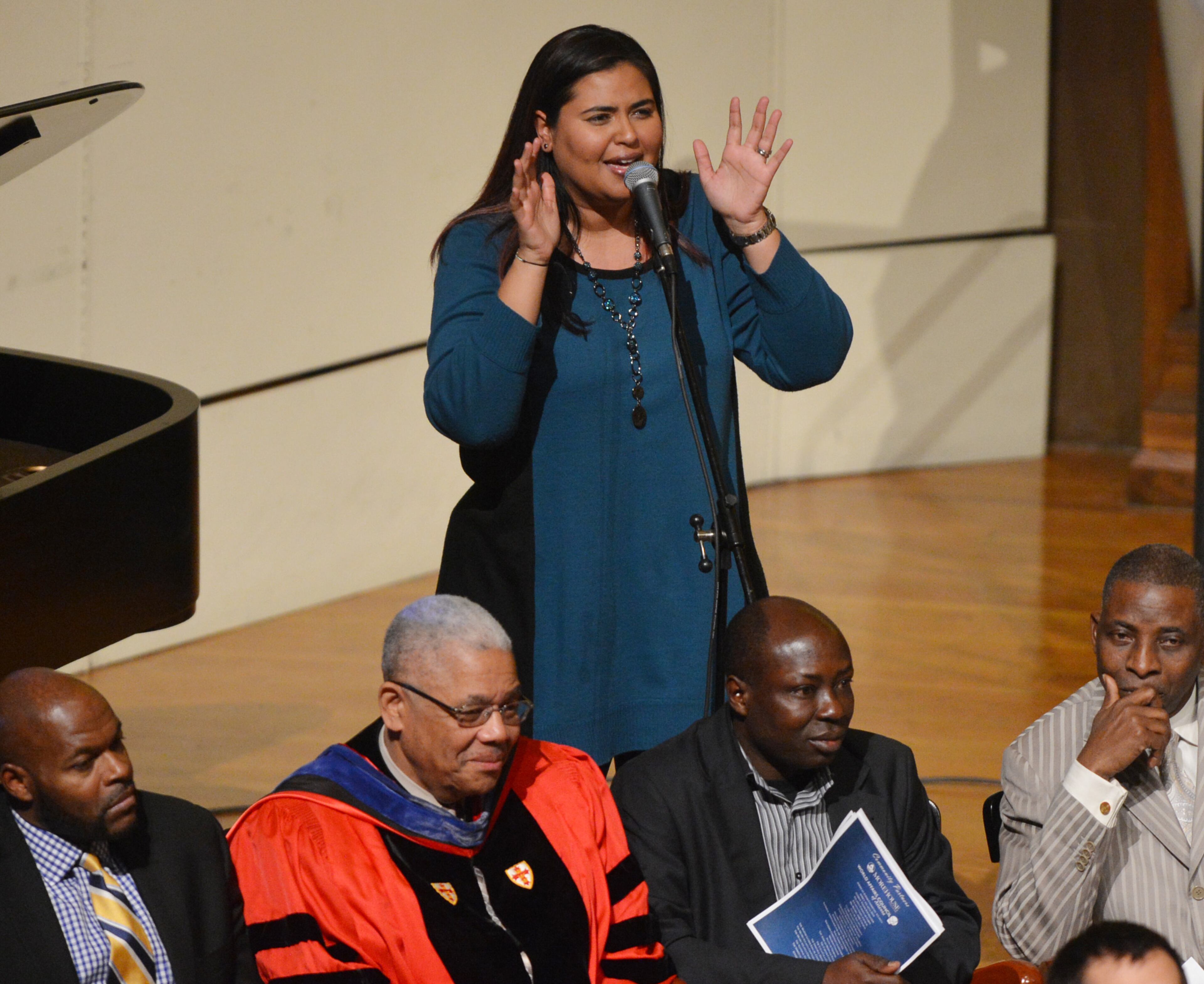 Genine Betchley gives a musical tribute during ther ceremony.