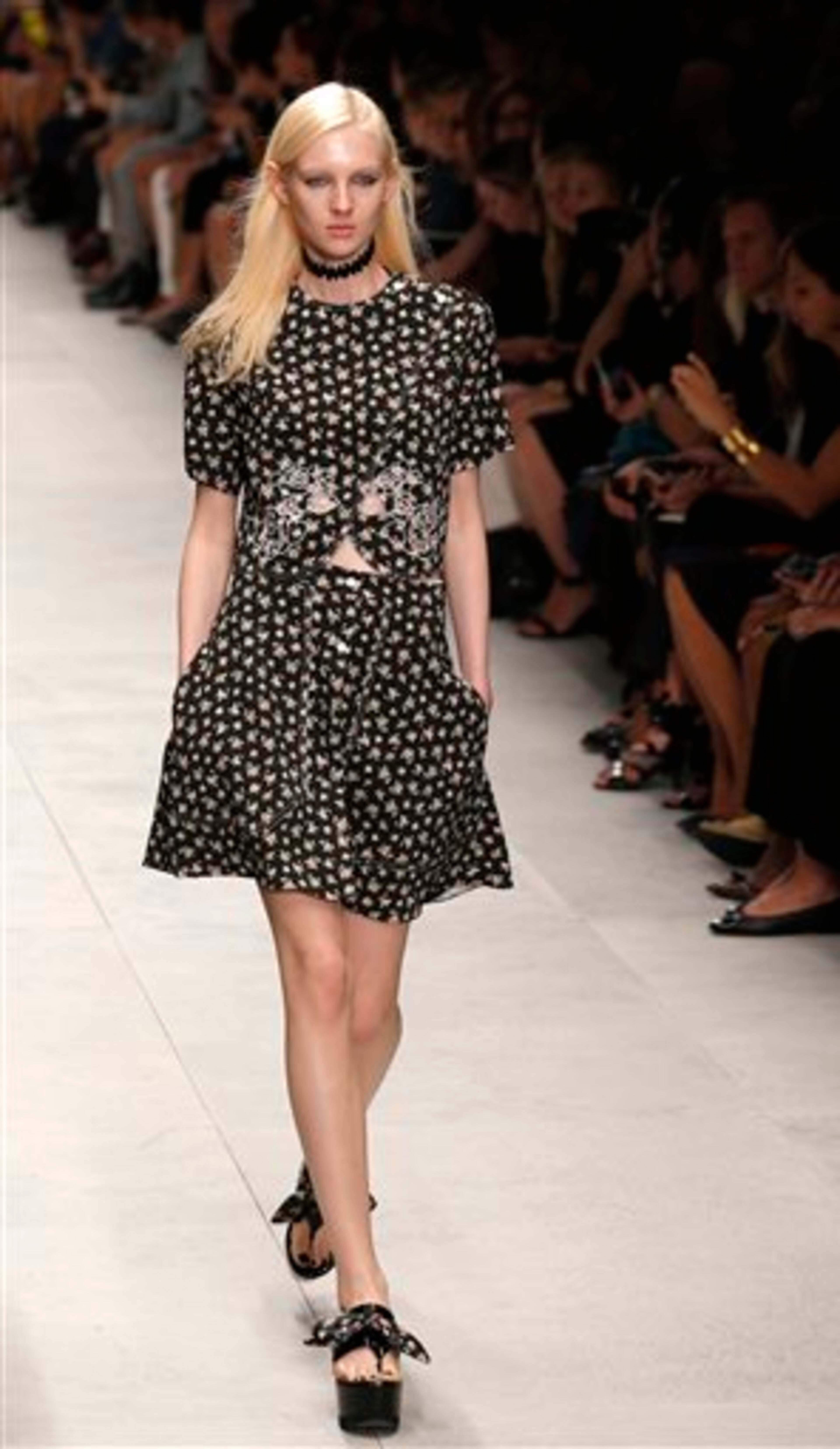 A model presents a creation as part of Carven's ready-to-wear Spring/Summer 2014 fashion collection presented in Paris, Thursday, Sept. 26, 2013. (AP Photo/Christophe Ena)