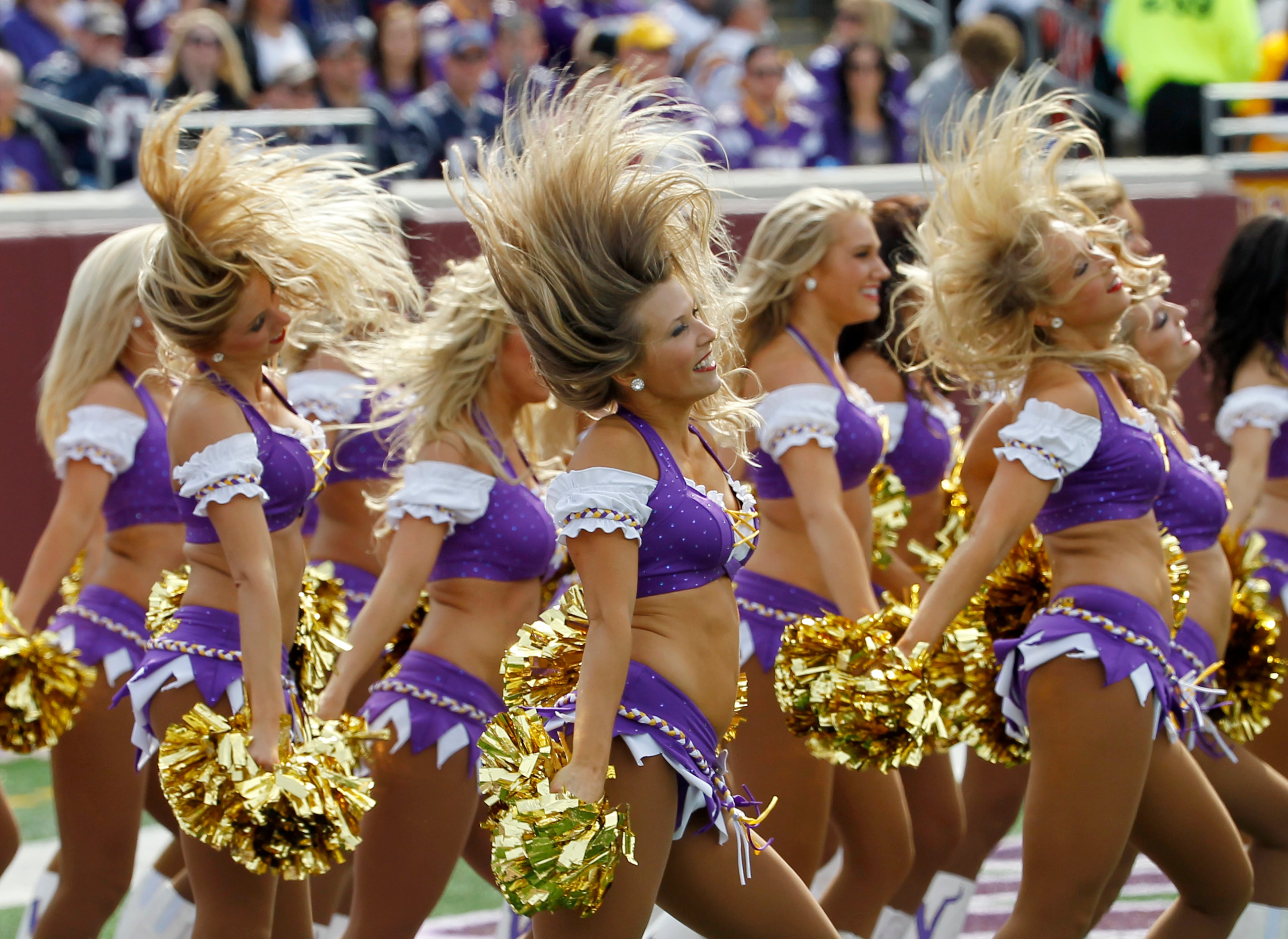 Minnesota Vikings cheerleaders perform during the first half of an NFL football game against the New England Patriots in Minneapolis Sunday, Sept. 14, 2014. (AP Photo/Ann Heisenfelt)