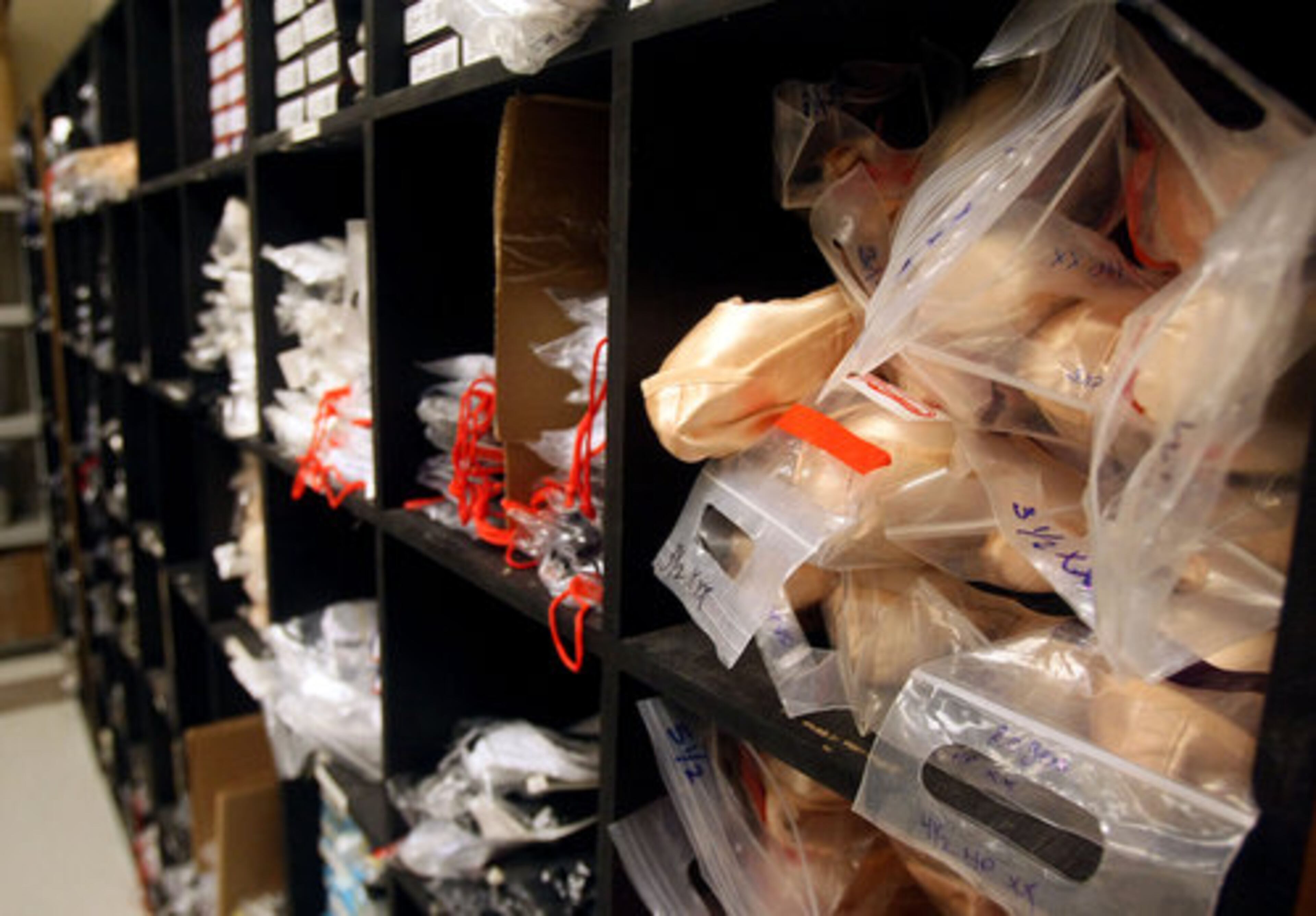 Ballet shoes fill bins of various sizes in the shoe room.