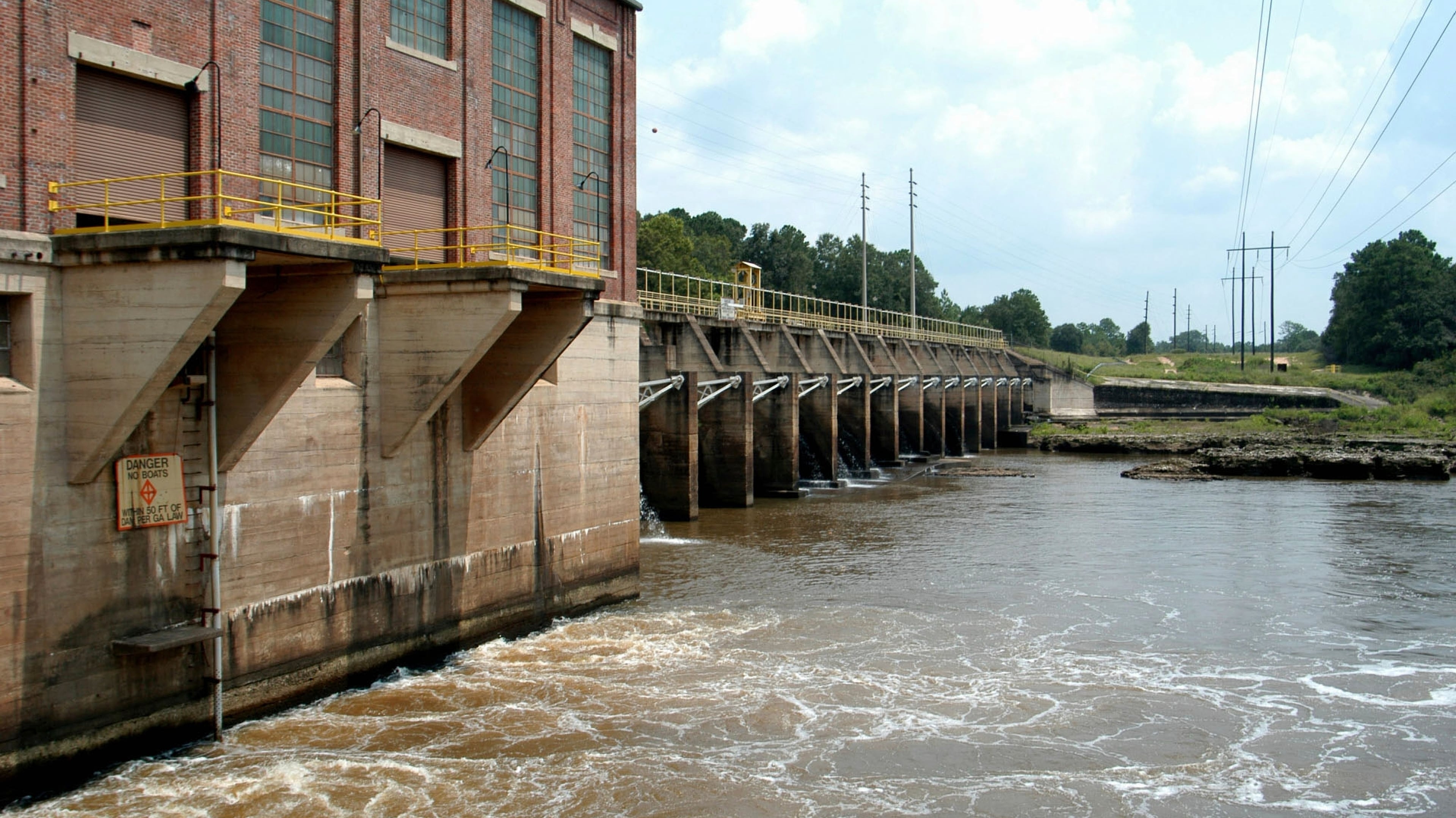 FILE - Water swirls through the Georgia Power Co. dam on the Flint River north of Albany, Ga., Aug. 18, 2003. (AP Photo, Elliott Minor, File)