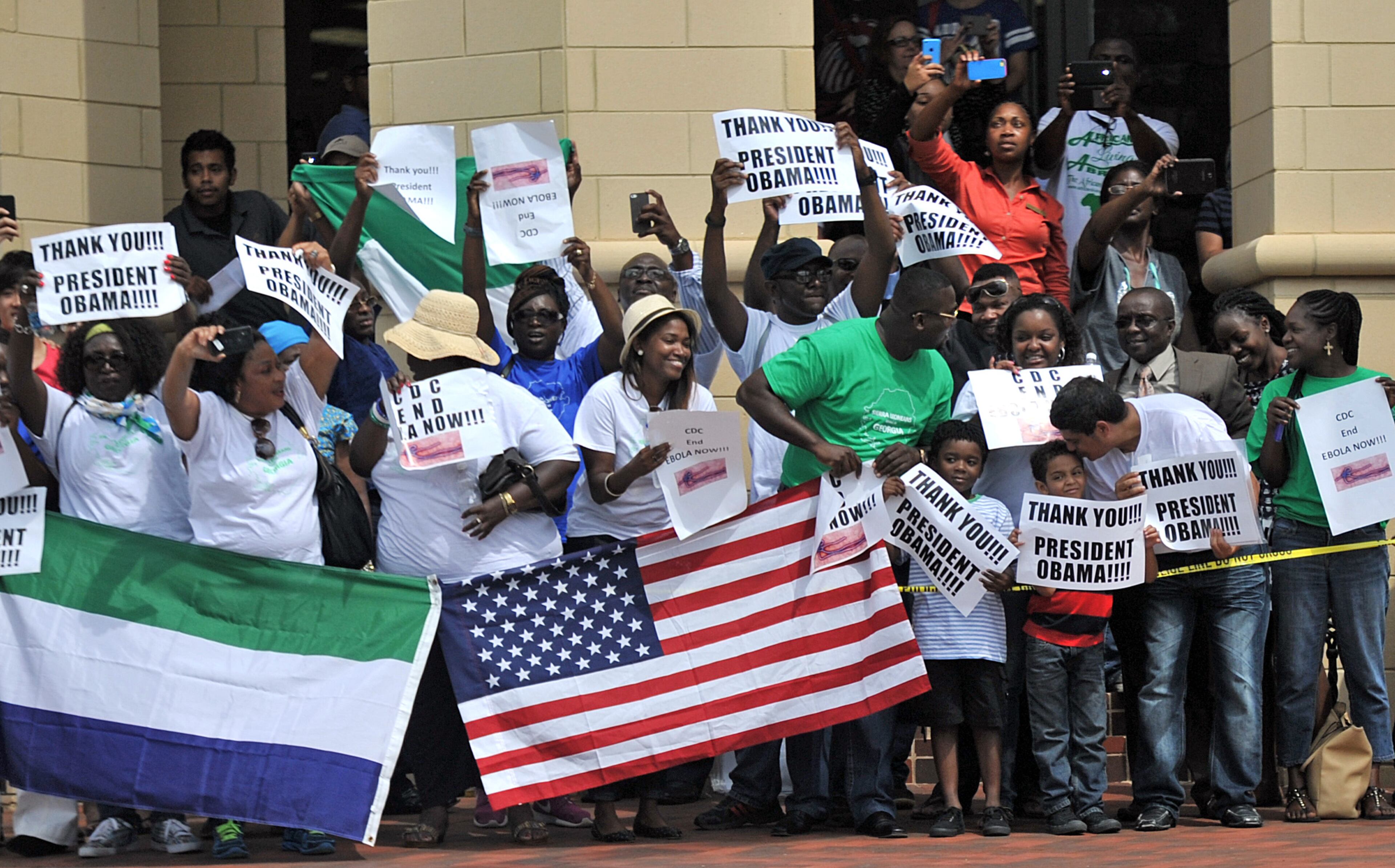 Spectators cheer as President Barack Obama heads to the Centers for Disease Control and Prevention in Atlanta on Tuesday, September, 16, 2014.