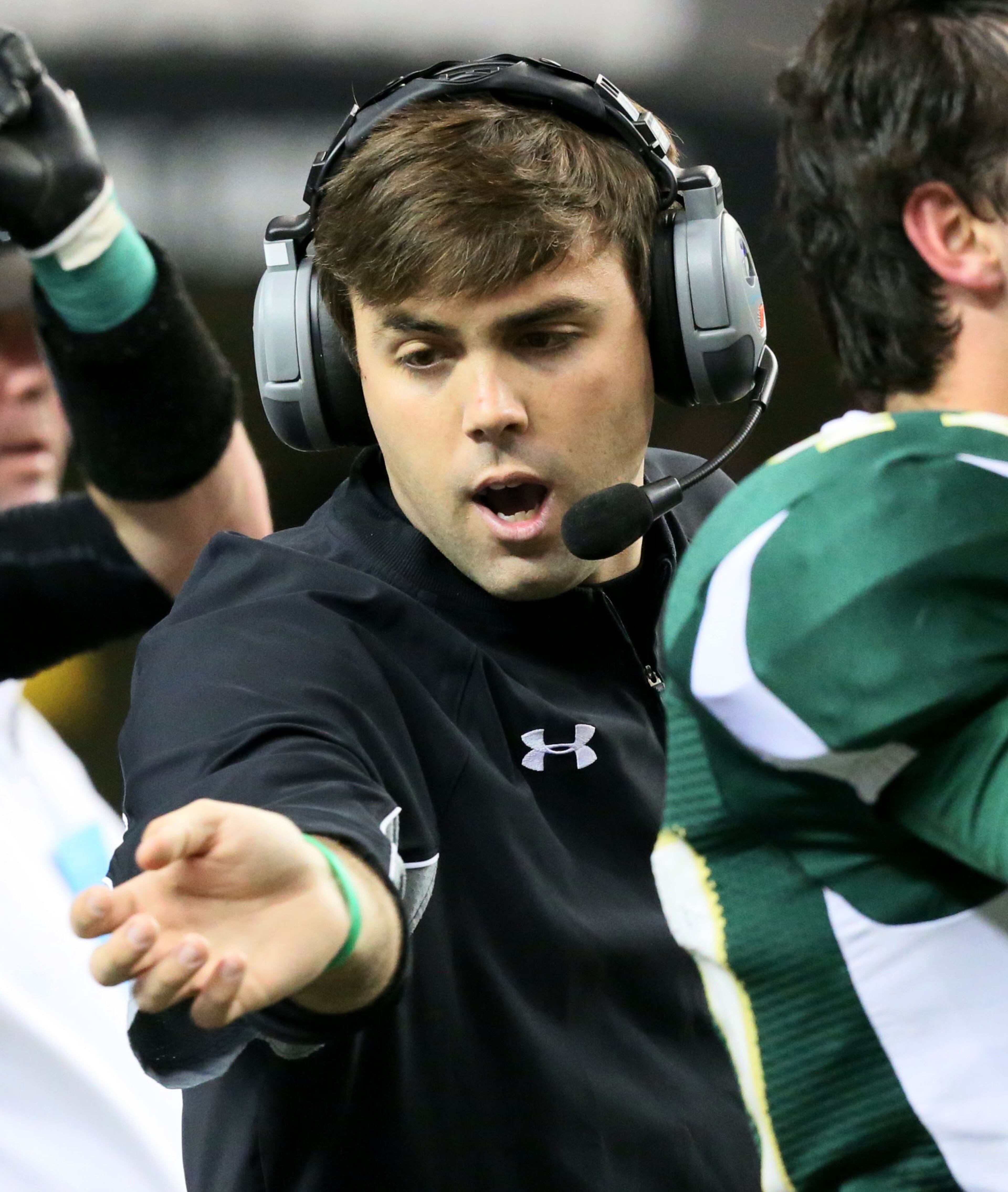 Aquinas High School (Augusta) head coach James Leonard directs his players against the Calvary Day School (Savannah) during their GHSA Football A-Private State Championship game at the Georgia Dome in Atlanta on Friday December 13th, 2013.