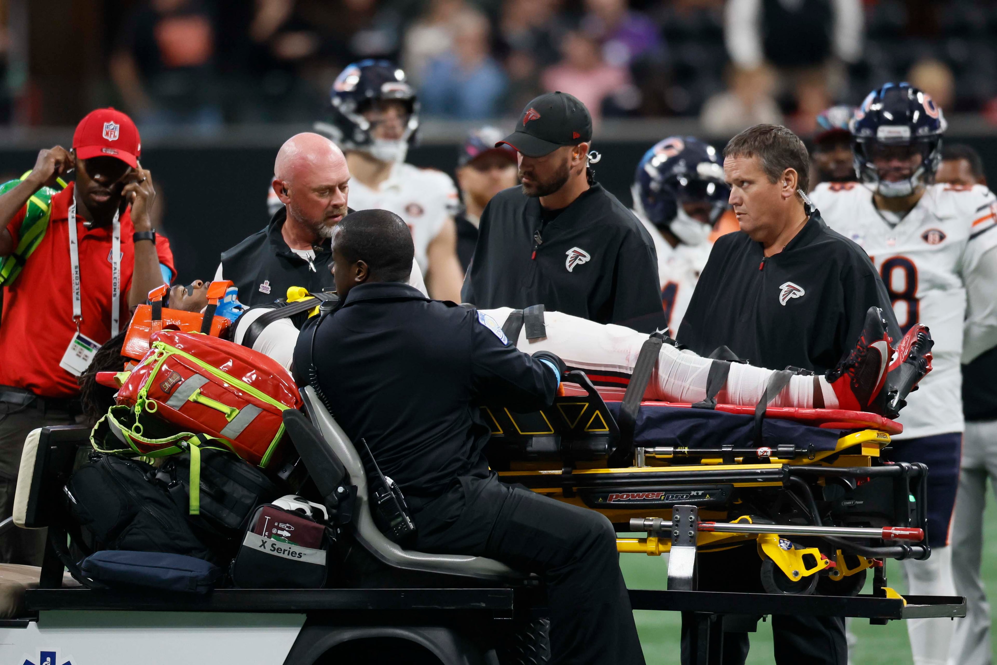 Atlanta Falcons linebacker Kendal Daniels is moved off the field on a stretcher as he receives medical attention from the medical staff after an injury in the second half of an NFL game against the Chicago Bears at Mercedes-Benz Stadium in Atlanta on Sunday, Oct. 18, 2026. (Miguel Martinez/AJC)